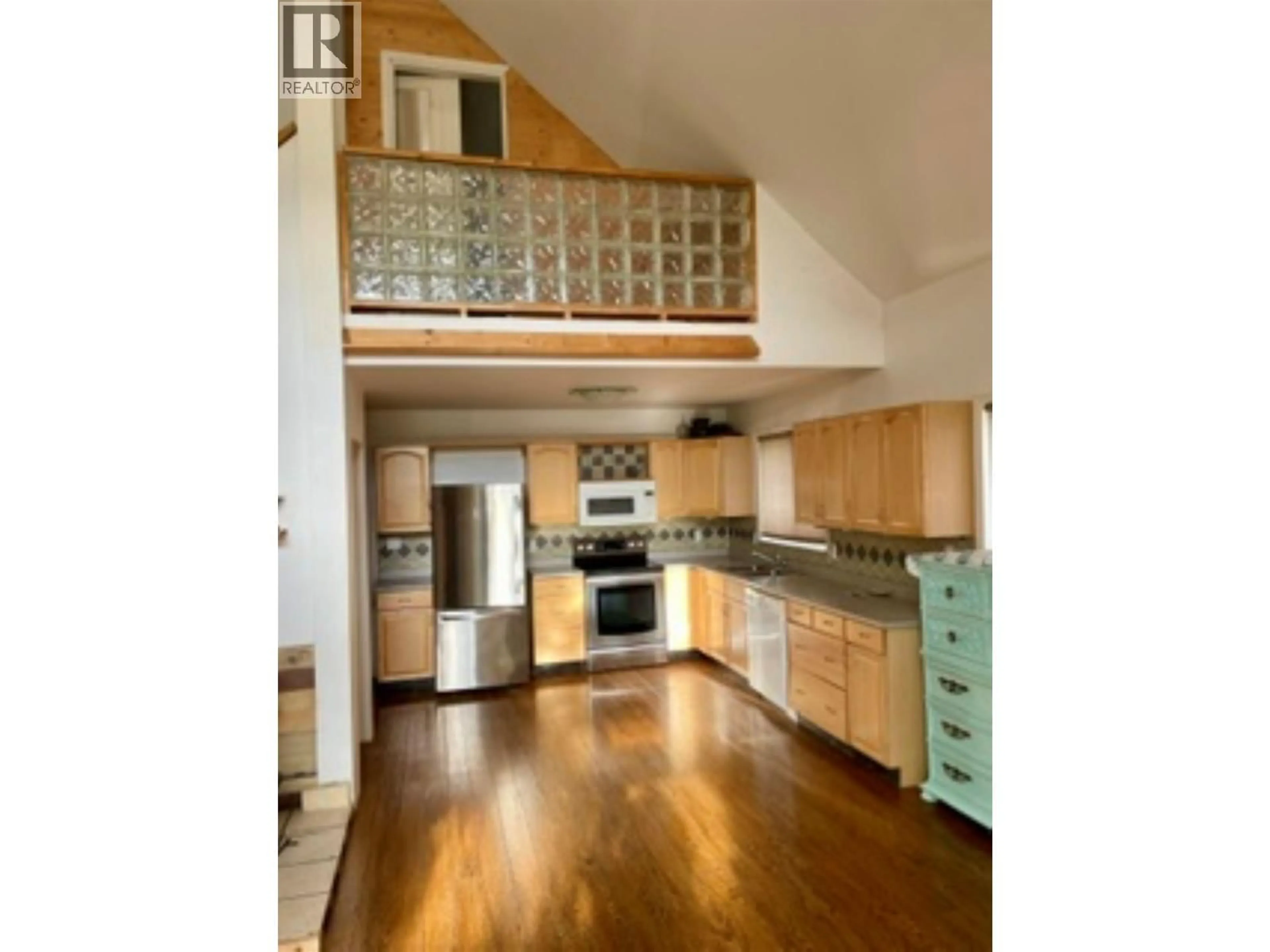 Open concept kitchen, wood/laminate floor for 368 CINNAMON STREET, Bear Lake British Columbia V0J3G0