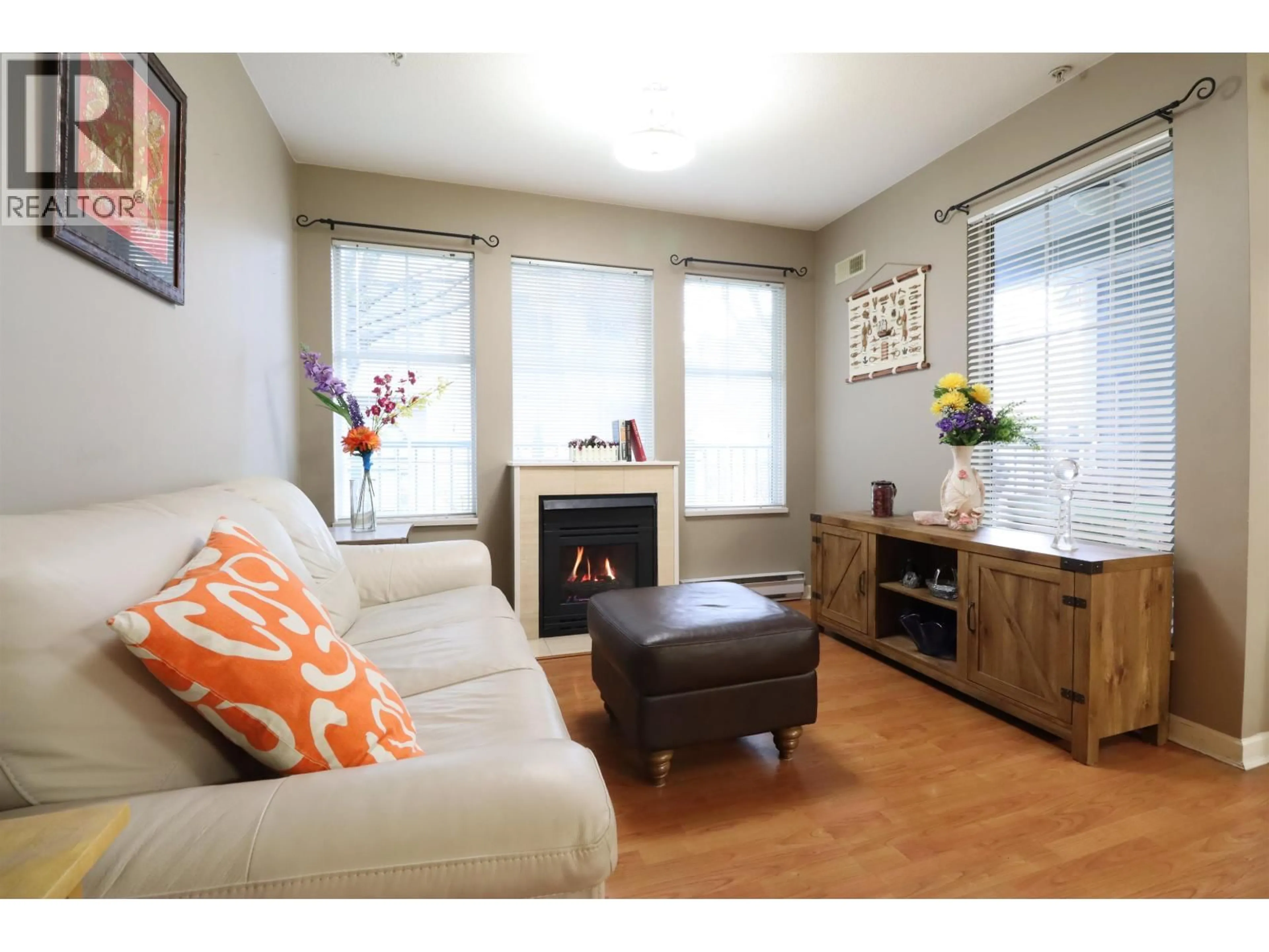 Living room with furniture, wood/laminate floor for 206 - 1199 WESTWOOD STREET, Coquitlam British Columbia V3B7P6