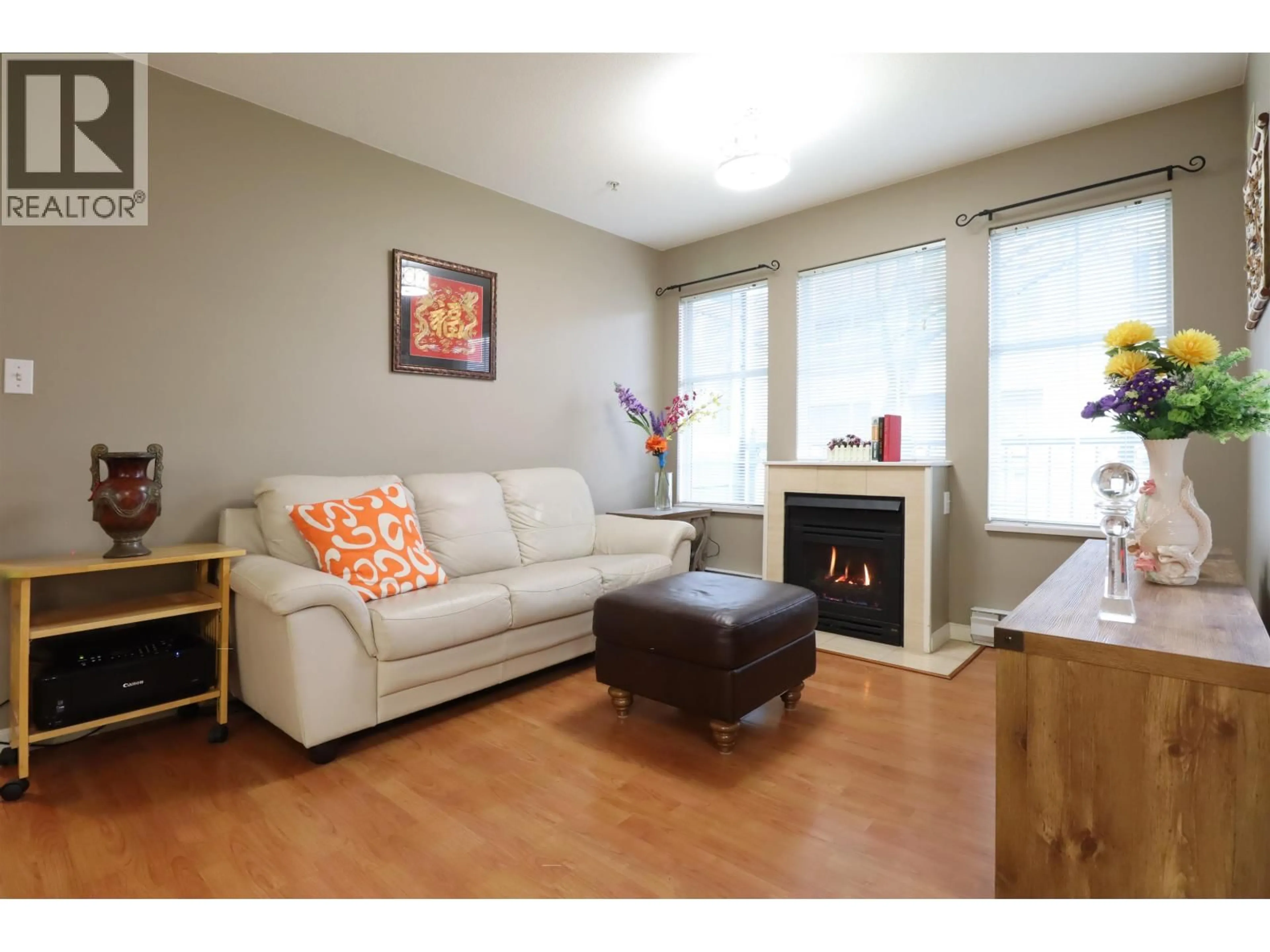 Living room with furniture, wood/laminate floor for 206 - 1199 WESTWOOD STREET, Coquitlam British Columbia V3B7P6