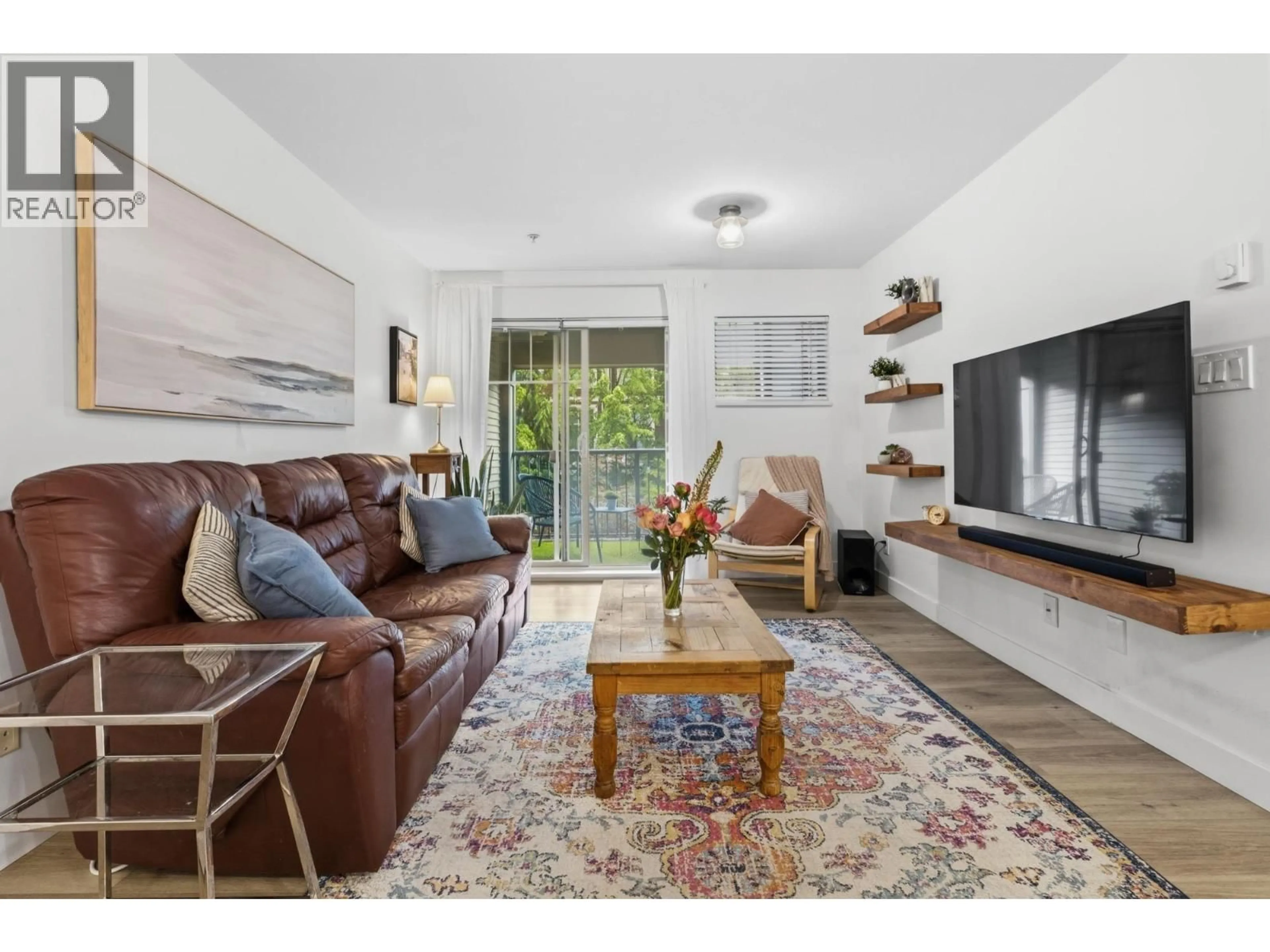 Living room with furniture, wood/laminate floor for 311 - 2468 ATKINS AVENUE, Port Coquitlam British Columbia V3C1Y9