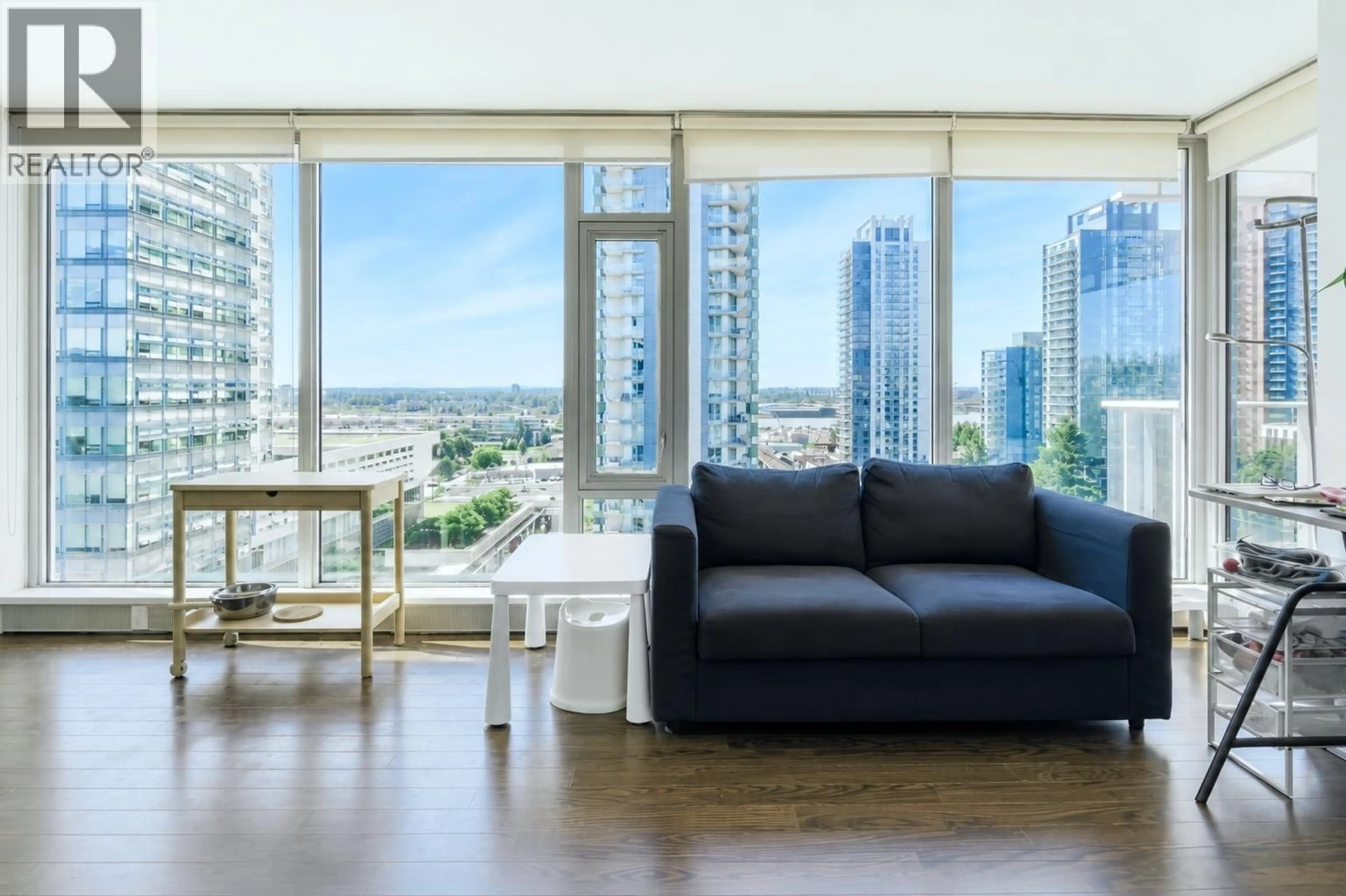 Living room with furniture, wood/laminate floor for 1508 - 8131 NUNAVUT LANE, Vancouver British Columbia V5X0E2