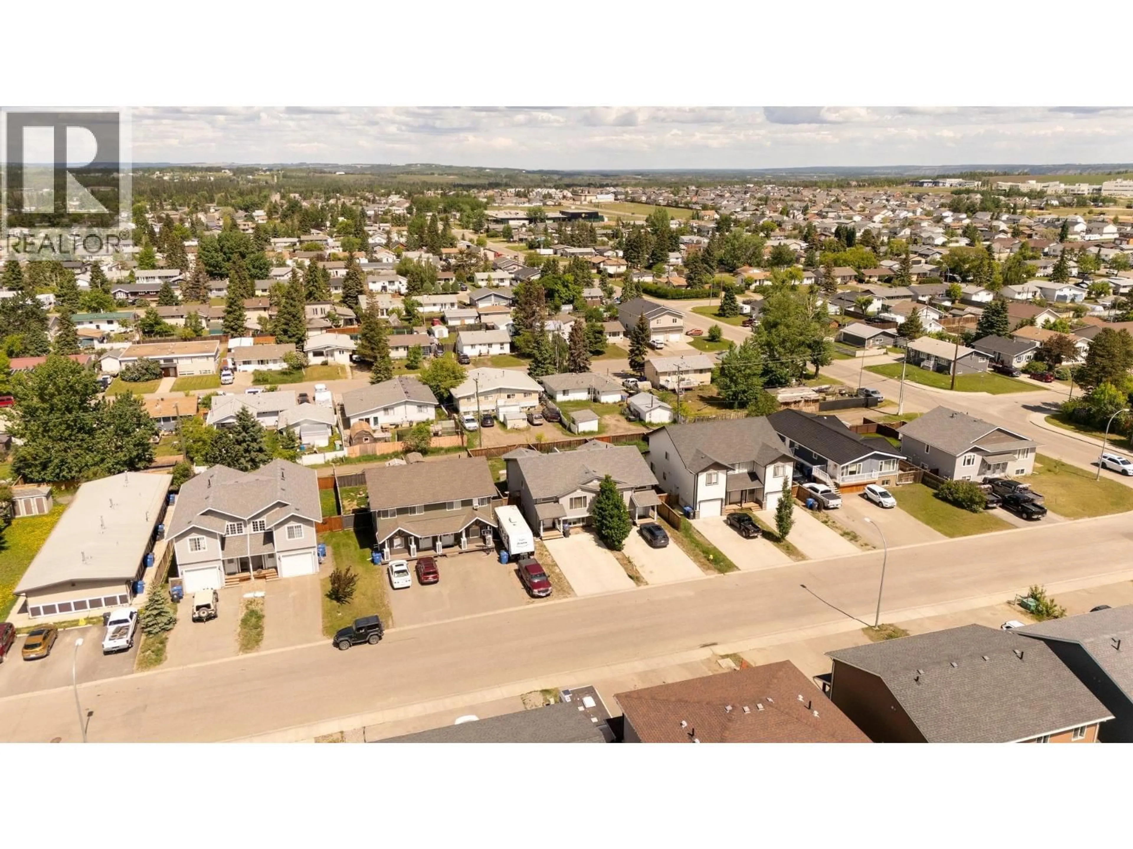 A pic from outside/outdoor area/front of a property/back of a property/a pic from drone, street for 9218 102 AVENUE, Fort St. John British Columbia V1J0J9