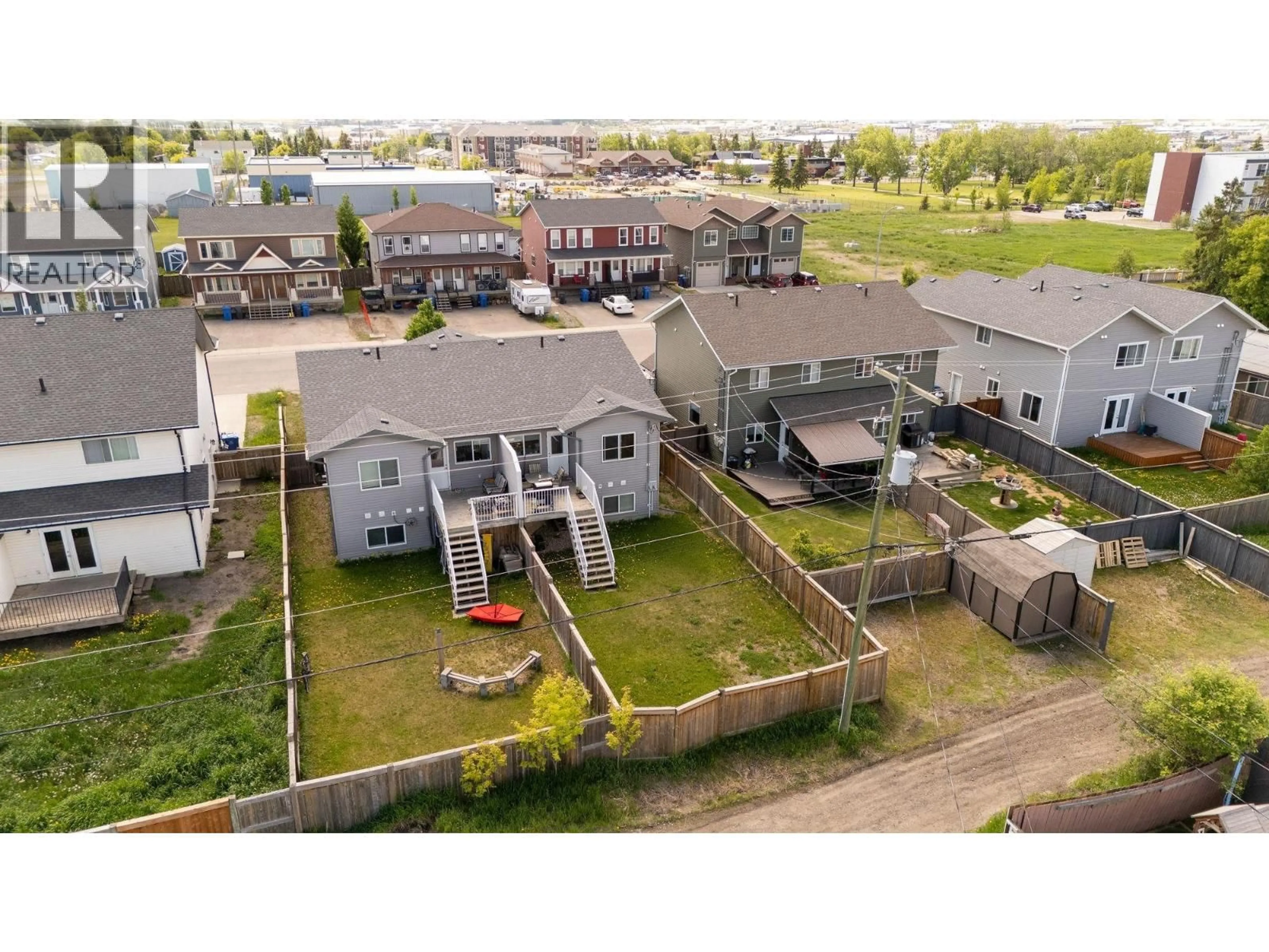 A pic from outside/outdoor area/front of a property/back of a property/a pic from drone, street for 9218 102 AVENUE, Fort St. John British Columbia V1J0J9