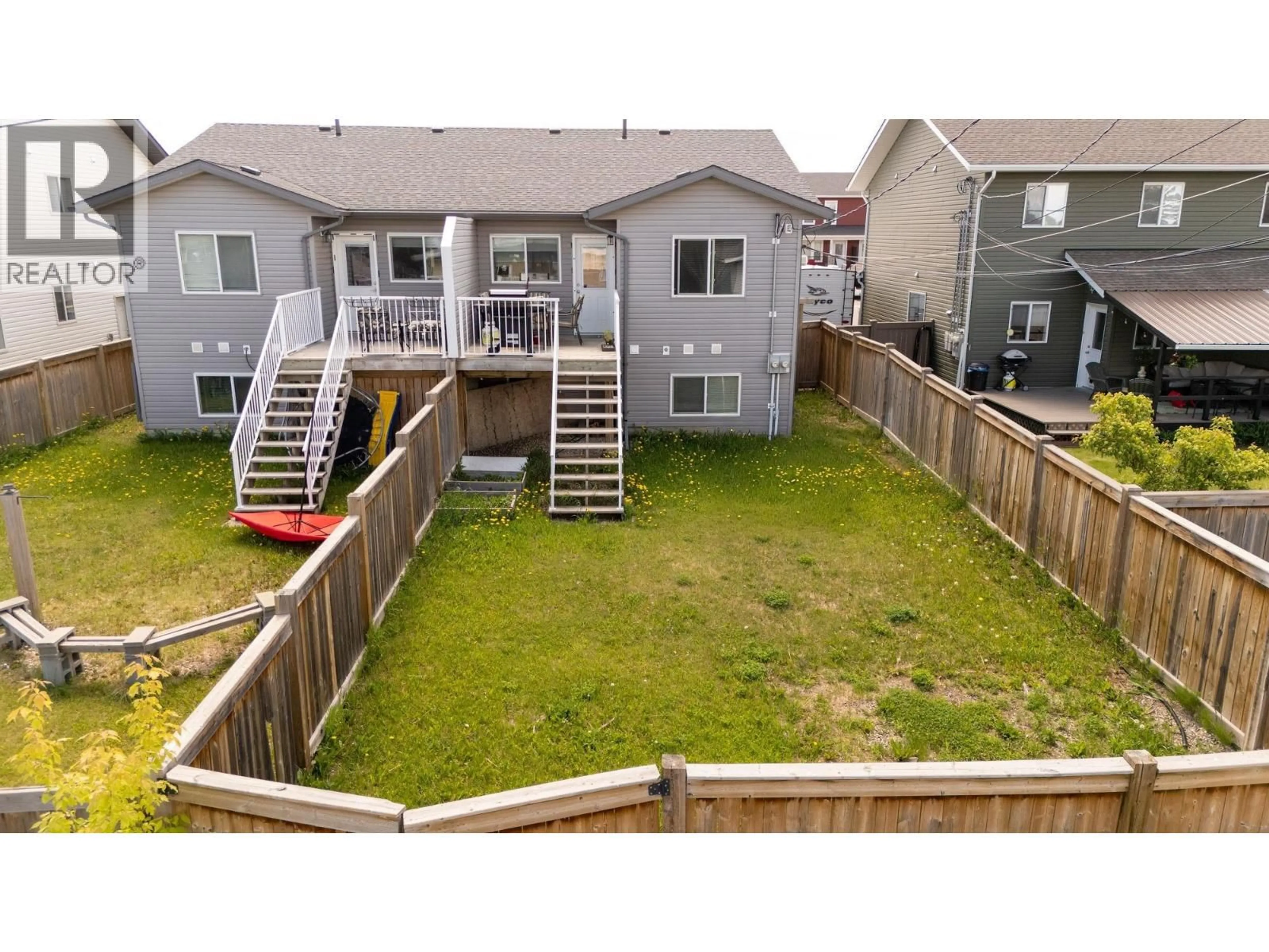 A pic from outside/outdoor area/front of a property/back of a property/a pic from drone, unknown for 9218 102 AVENUE, Fort St. John British Columbia V1J0J9