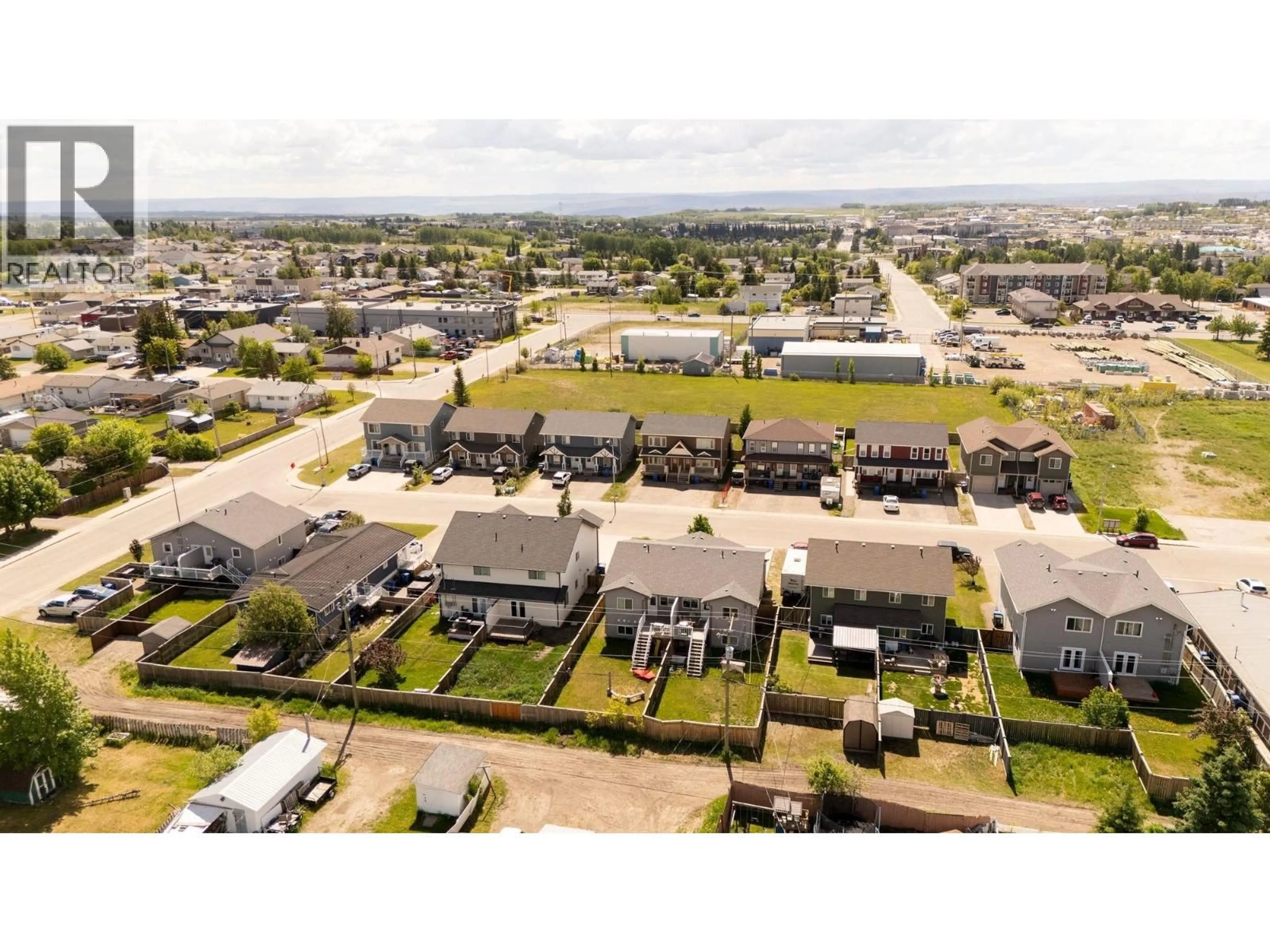 A pic from outside/outdoor area/front of a property/back of a property/a pic from drone, street for 9218 102 AVENUE, Fort St. John British Columbia V1J0J9