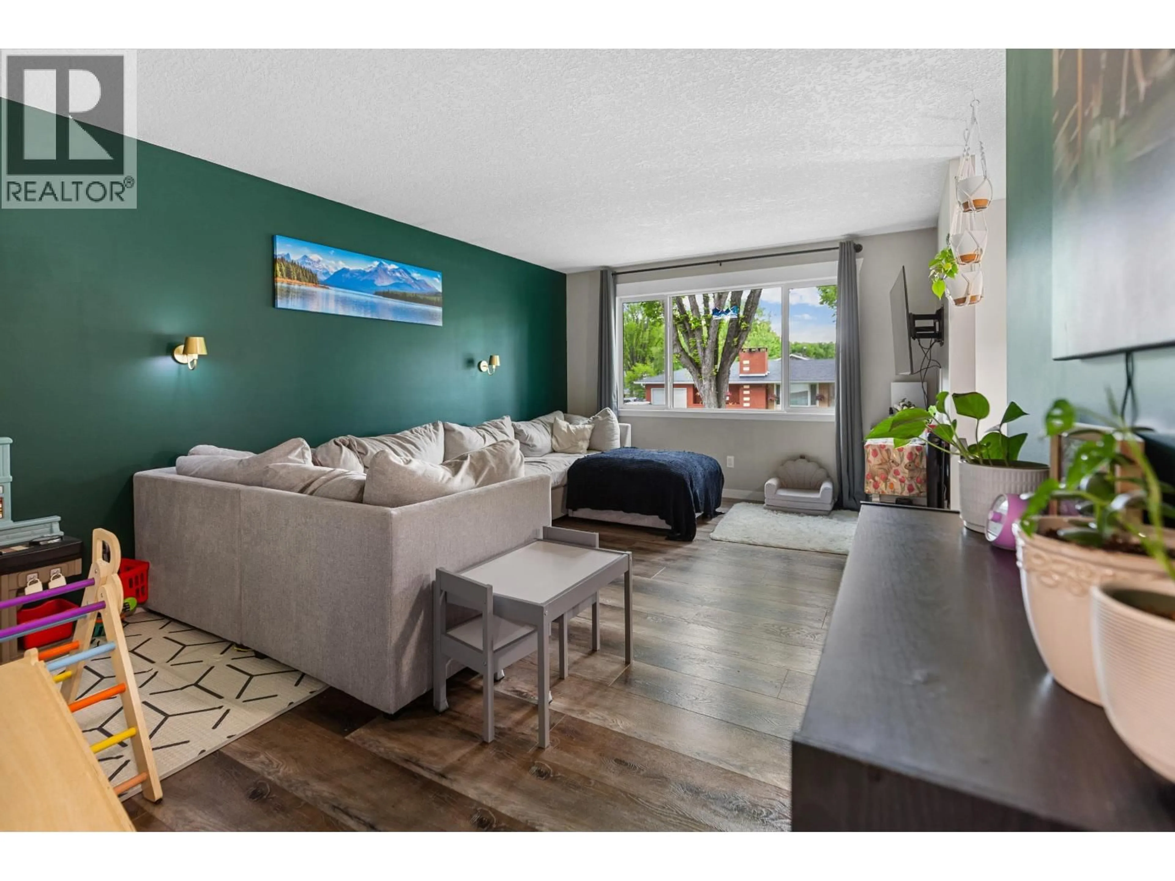 Living room with furniture, wood/laminate floor for 104 AITKEN CRESCENT, Prince George British Columbia V2L4N1