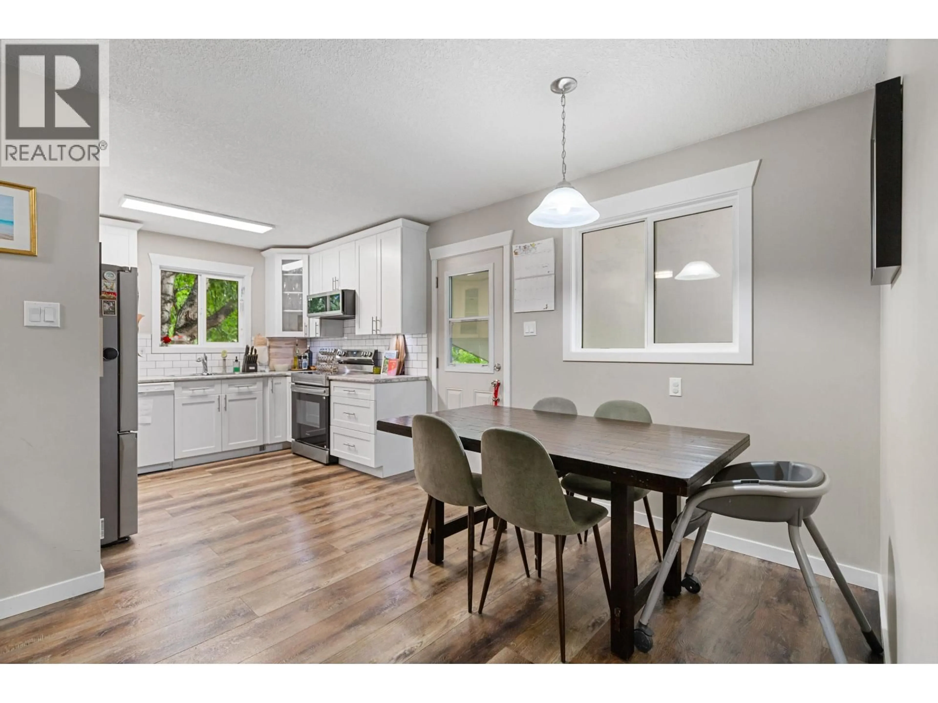 Open concept kitchen, wood/laminate floor for 104 AITKEN CRESCENT, Prince George British Columbia V2L4N1