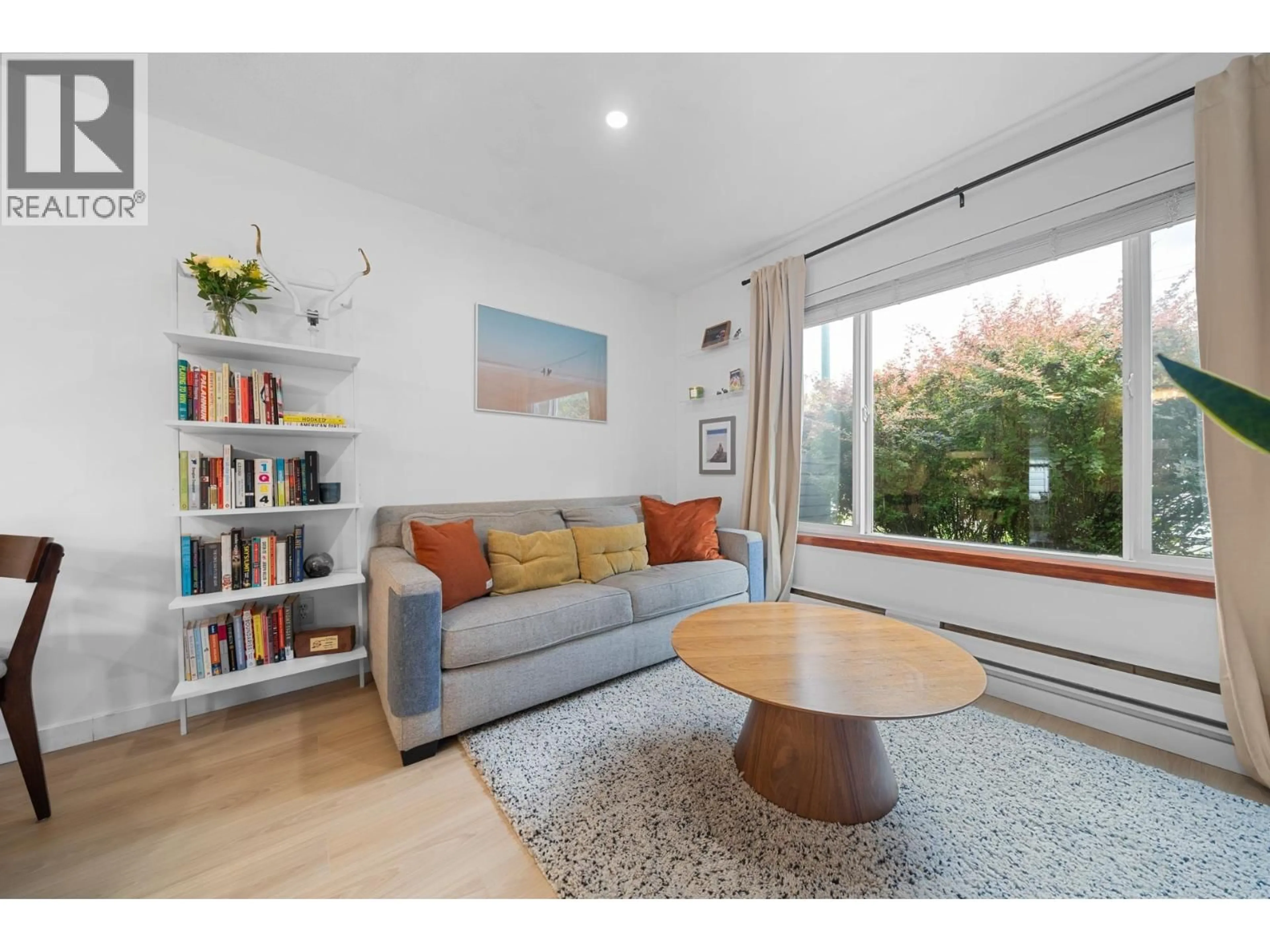 Living room with furniture, wood/laminate floor for 140 - 2390 MCGILL STREET, Vancouver British Columbia V5L1C6