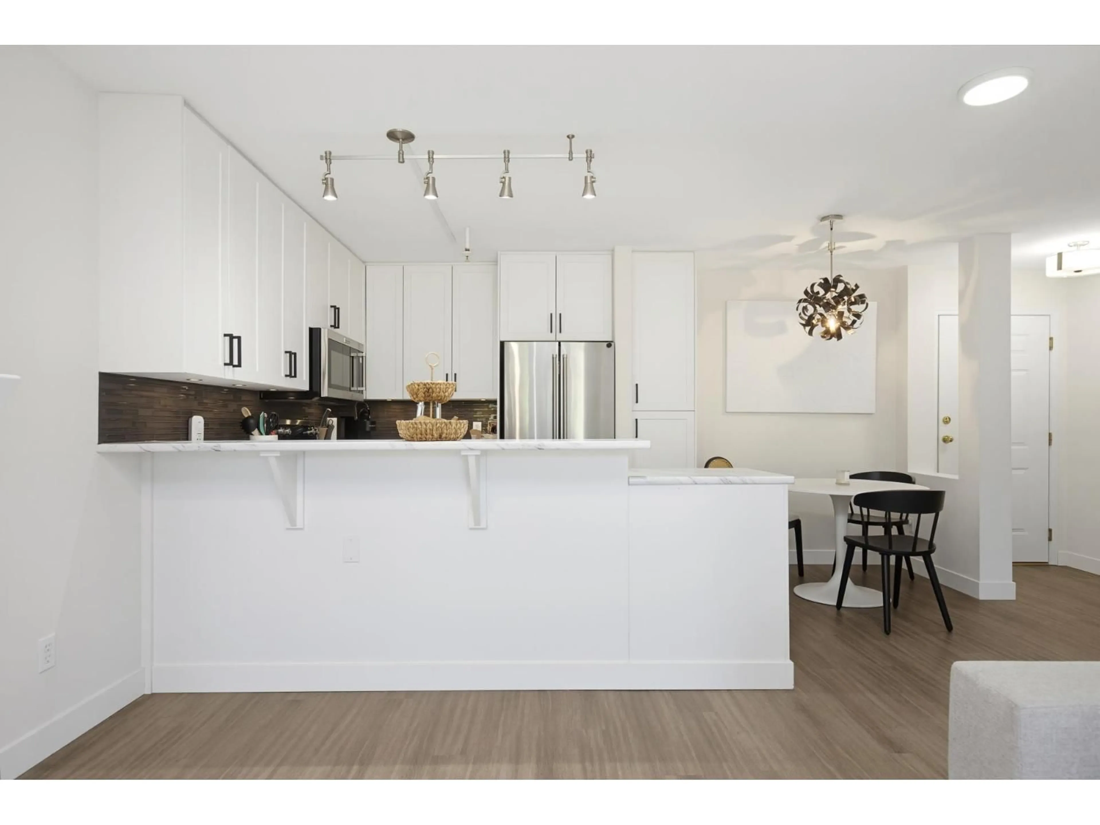 Open concept kitchen, wood/laminate floor for 112 - 22015 48 AVENUE, Langley British Columbia V3A8L3