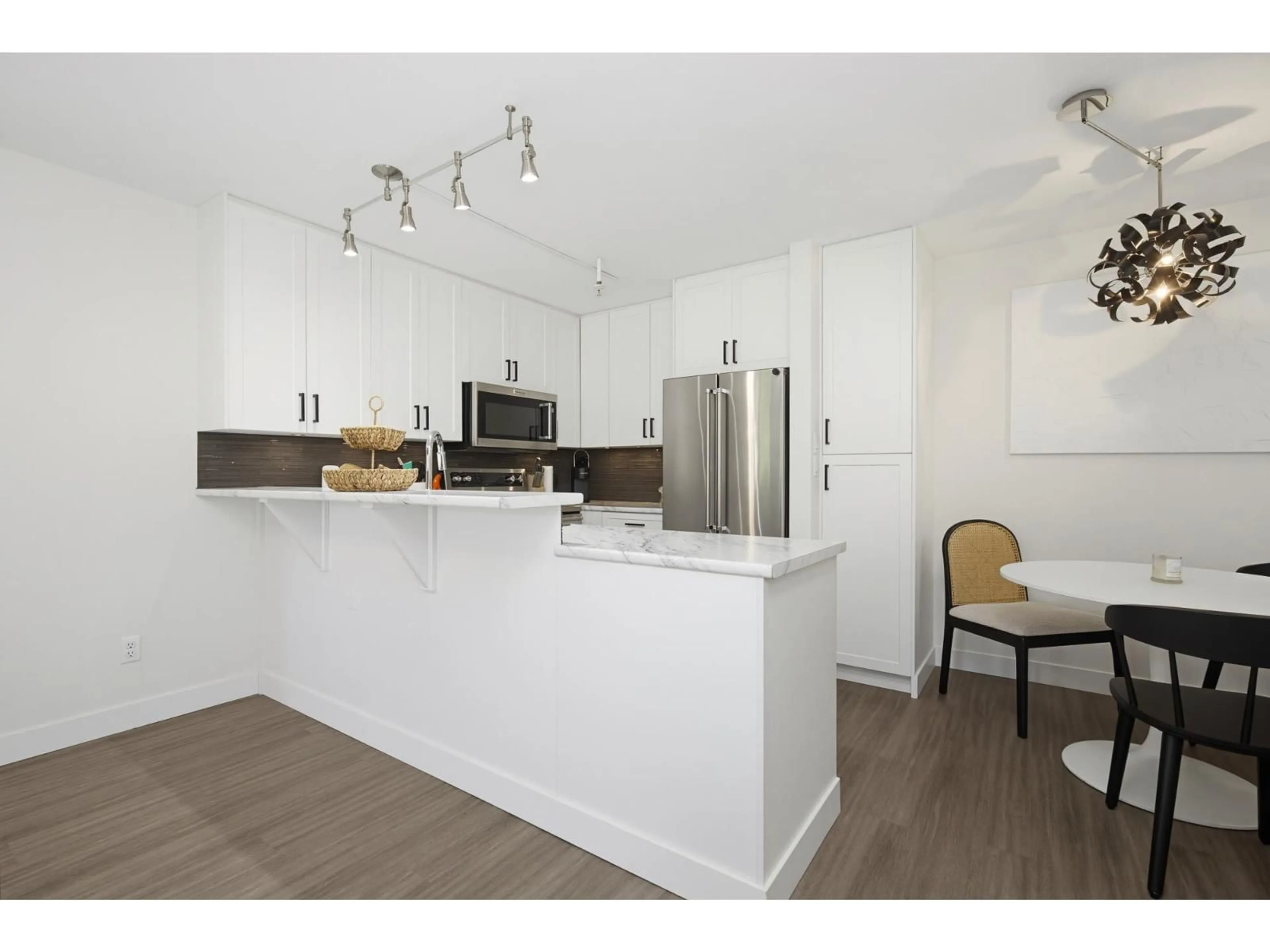 Open concept kitchen, wood/laminate floor for 112 - 22015 48 AVENUE, Langley British Columbia V3A8L3