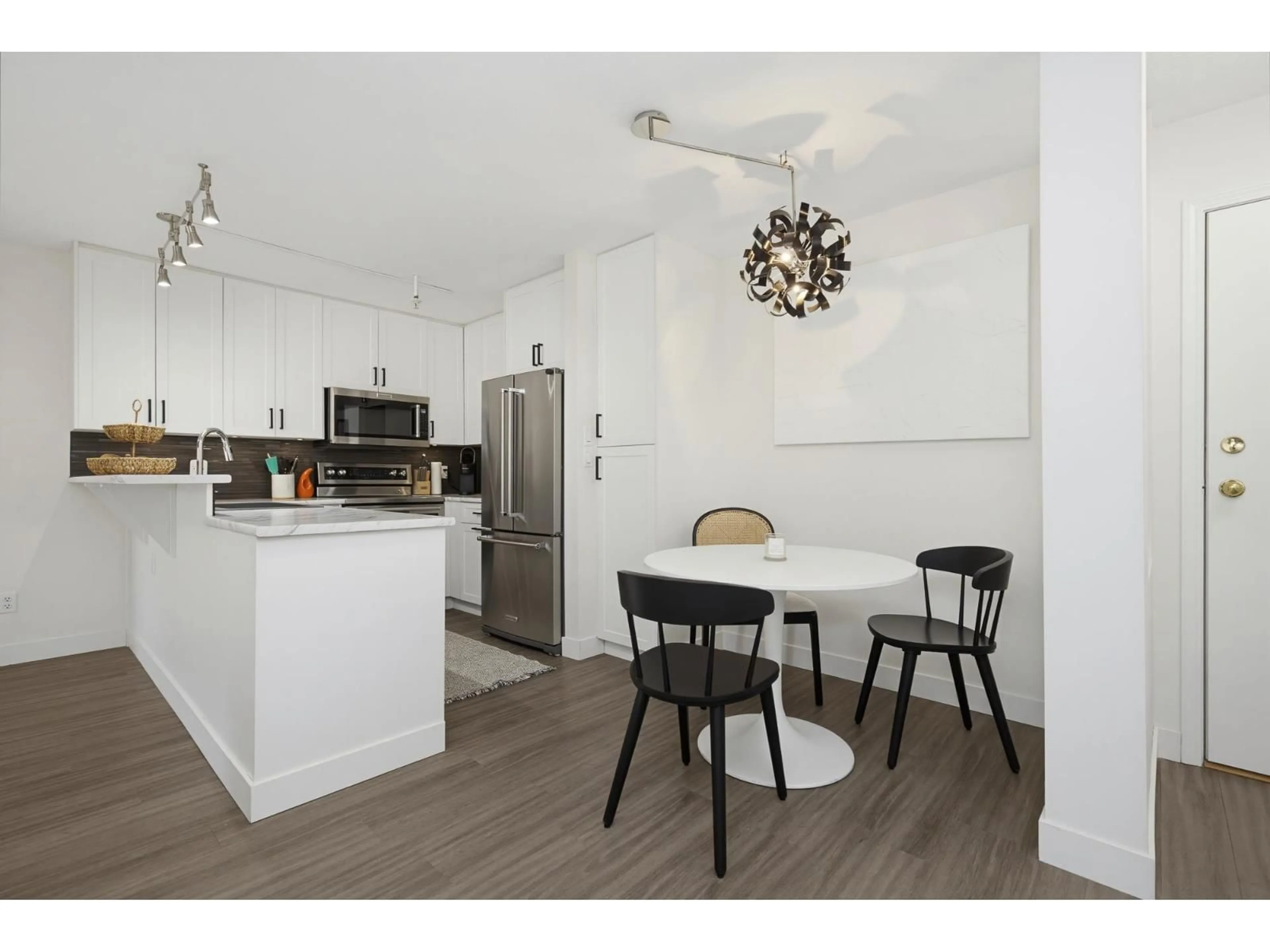 Open concept kitchen, wood/laminate floor for 112 - 22015 48 AVENUE, Langley British Columbia V3A8L3