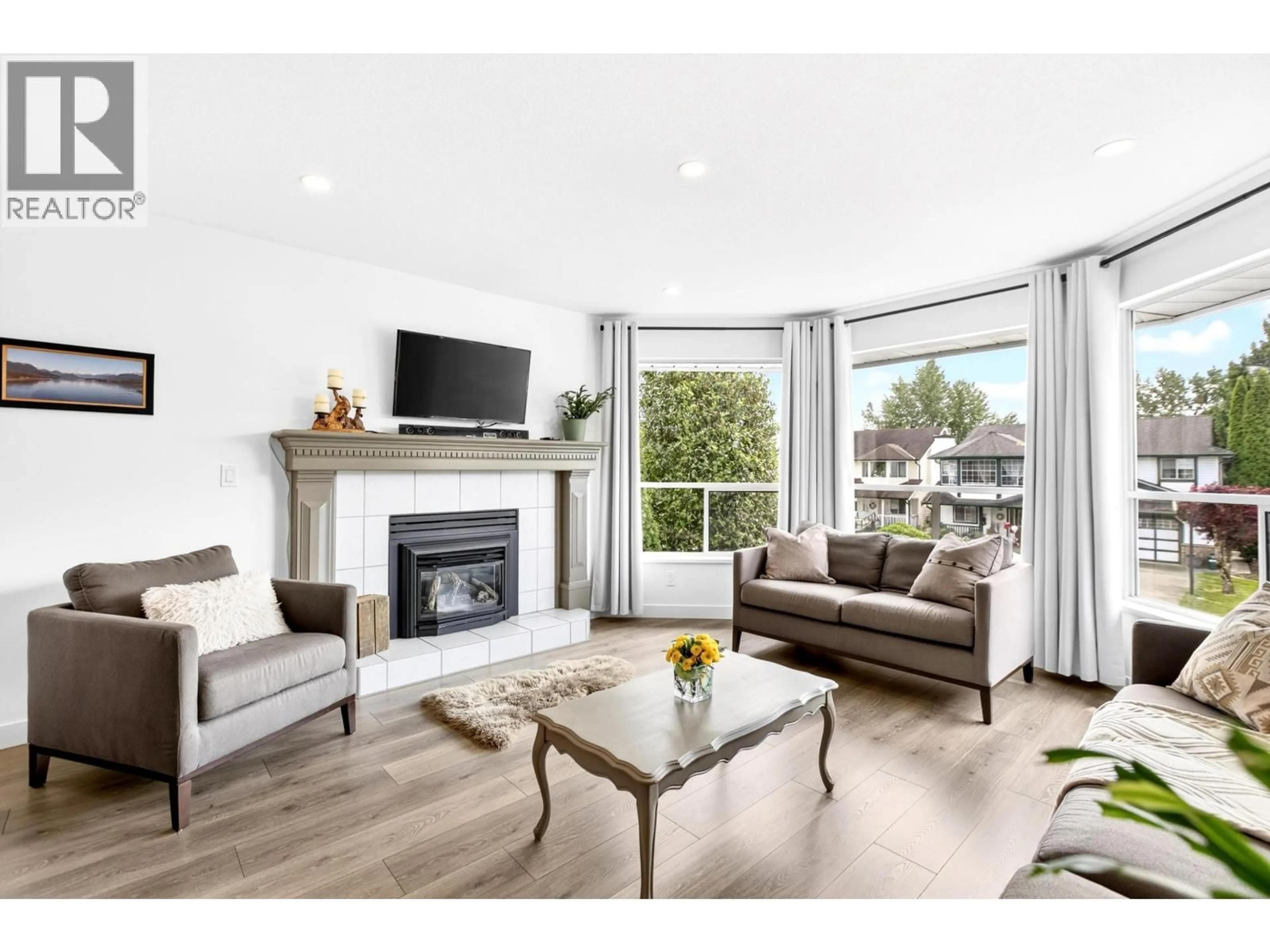 Living room with furniture, wood/laminate floor for 23239 116A AVENUE, Maple Ridge British Columbia V2X2K5
