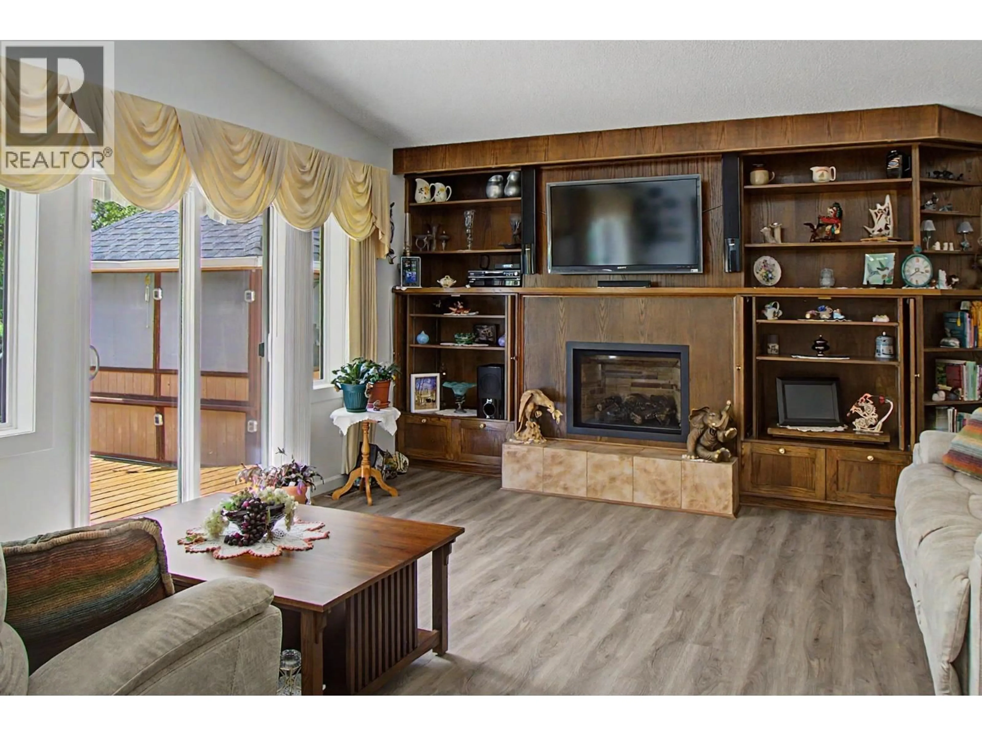 Living room with furniture, wood/laminate floor for 3819 BRENTWOOD PLACE, Prince George British Columbia V2K3Y1