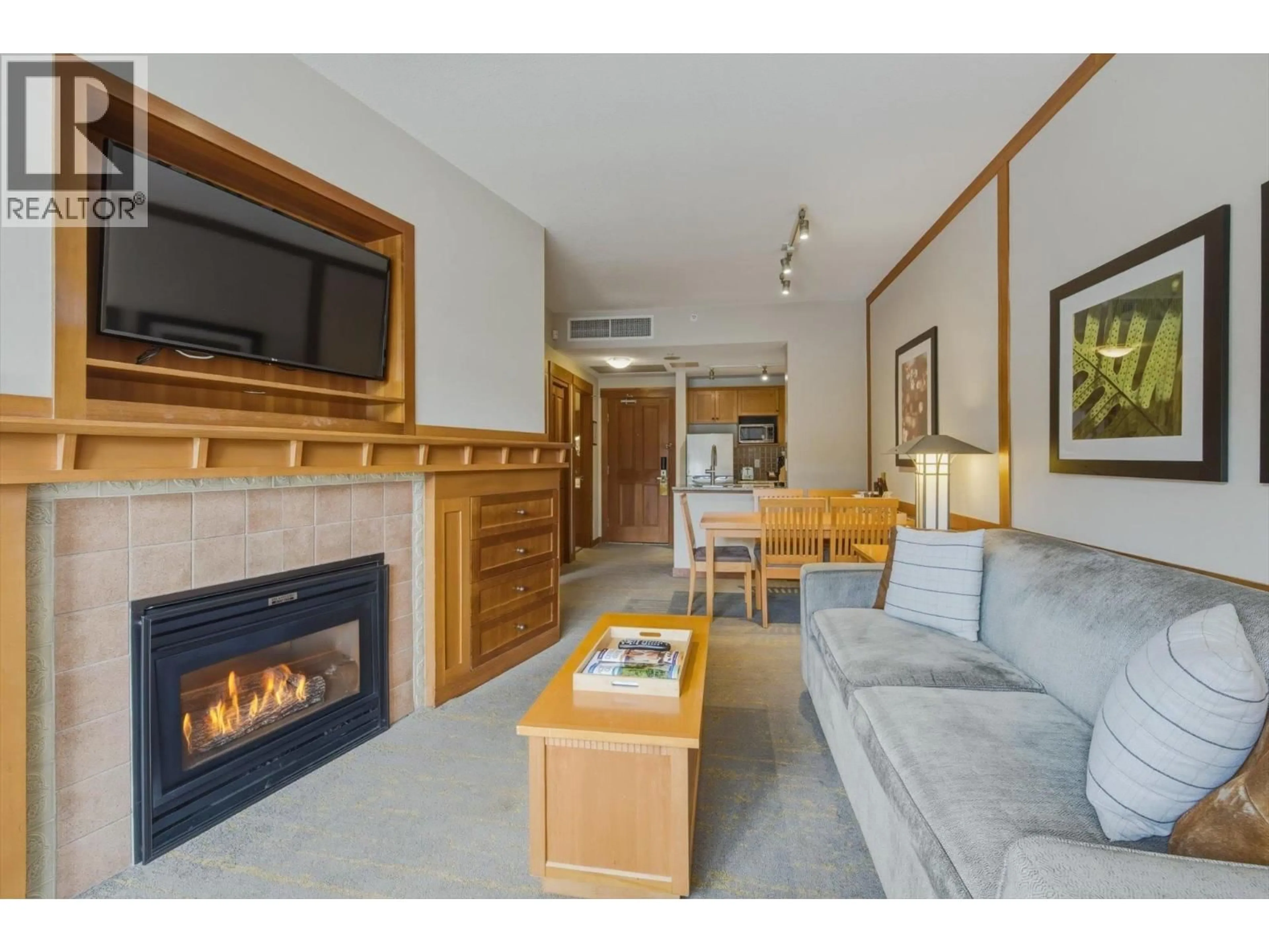 Living room with furniture, wood/laminate floor for 702 - 4320 SUNDIAL CRESCENT, Whistler British Columbia V8E1G6