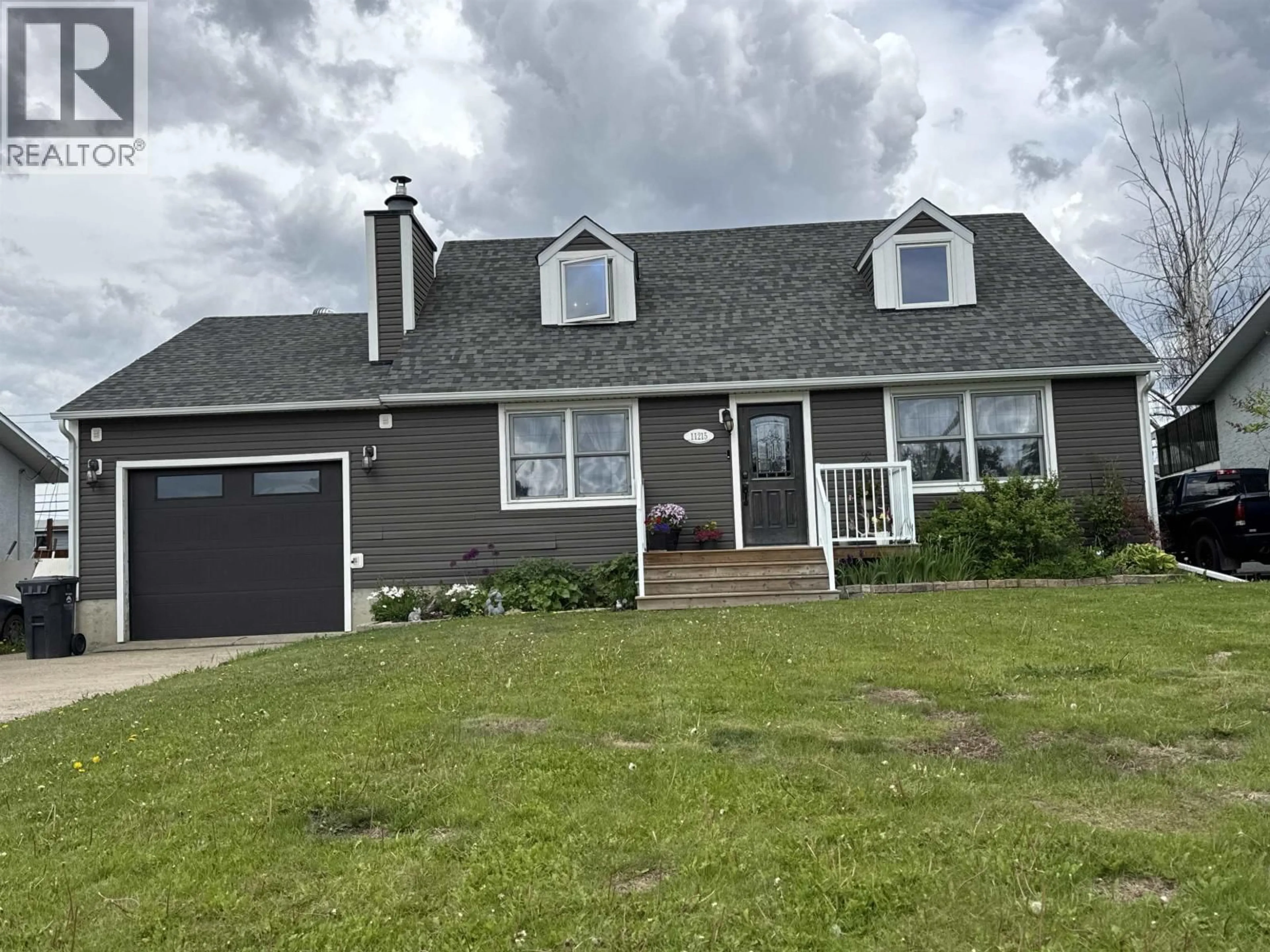 Home with vinyl exterior material, street for 11215 93 STREET, Fort St. John British Columbia V1J4W5