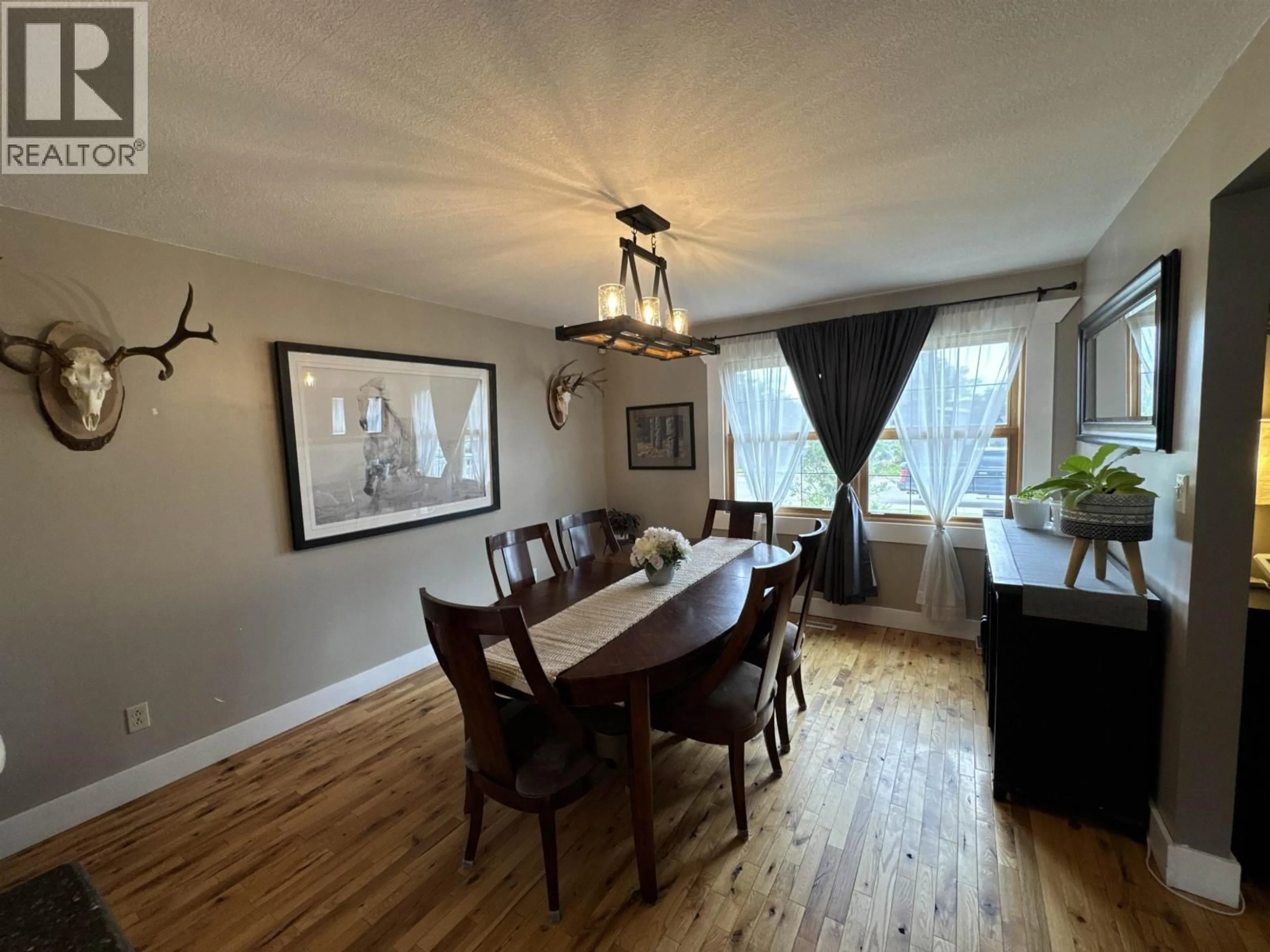 Dining room, wood/laminate floor for 11215 93 STREET, Fort St. John British Columbia V1J4W5