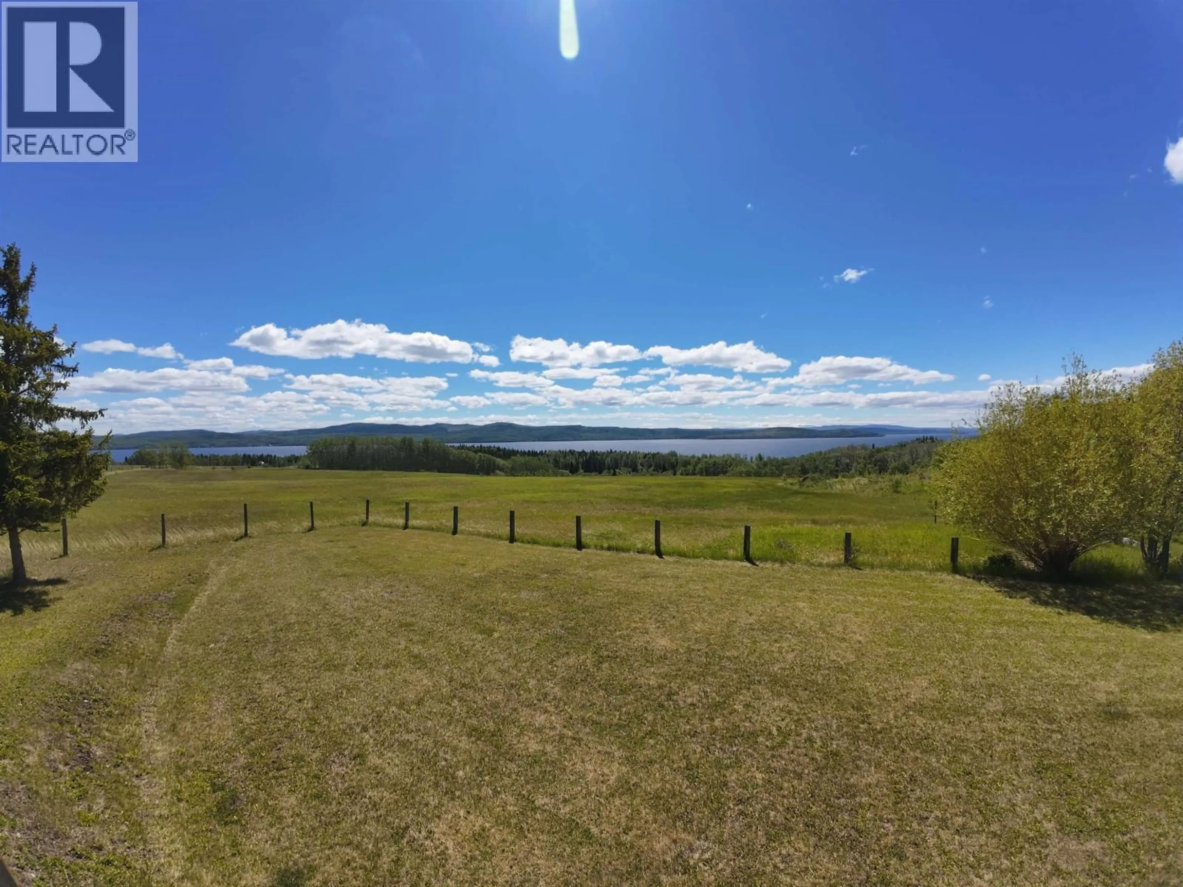 A pic from outside/outdoor area/front of a property/back of a property/a pic from drone, water/lake/river/ocean view for 7227 BROWN ROAD, Burns Lake British Columbia V0J1E2