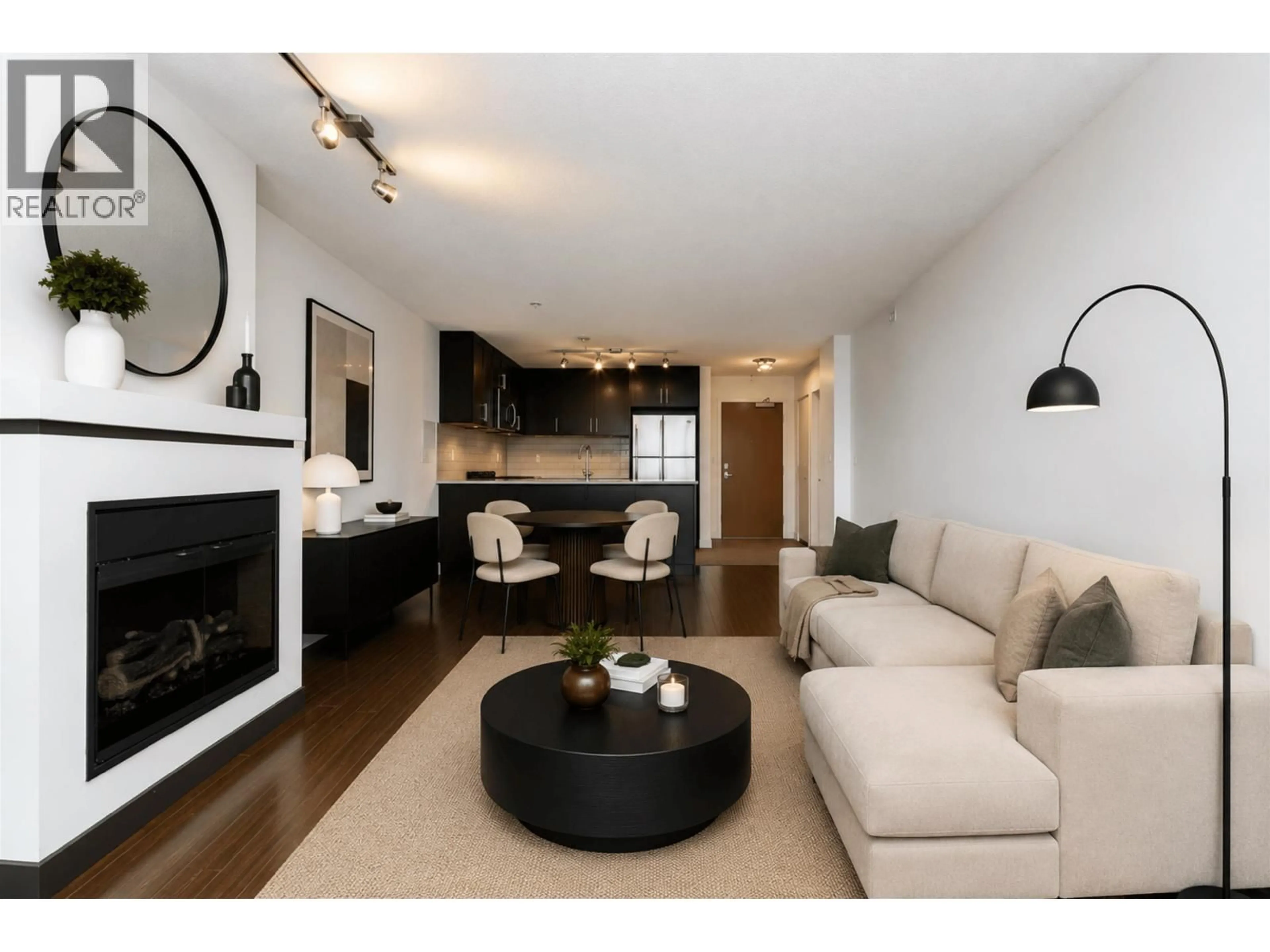 Living room with furniture, wood/laminate floor for 605 - 660 NOOTKA WAY, Port Moody British Columbia V3H0B7