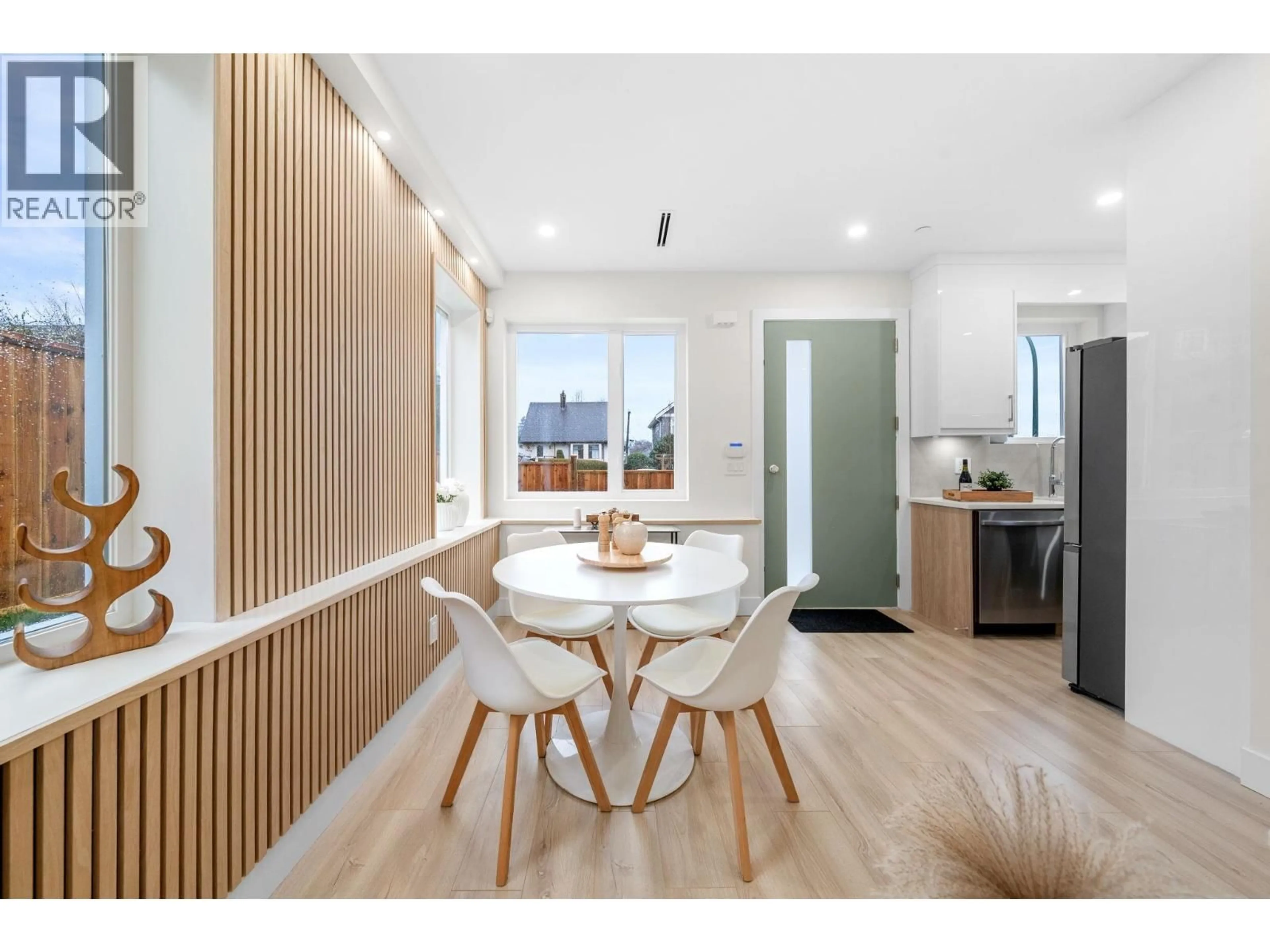 Open concept kitchen, wood/laminate floor for 1 - 3581 HAIDA DRIVE, Vancouver British Columbia V5M3Y9