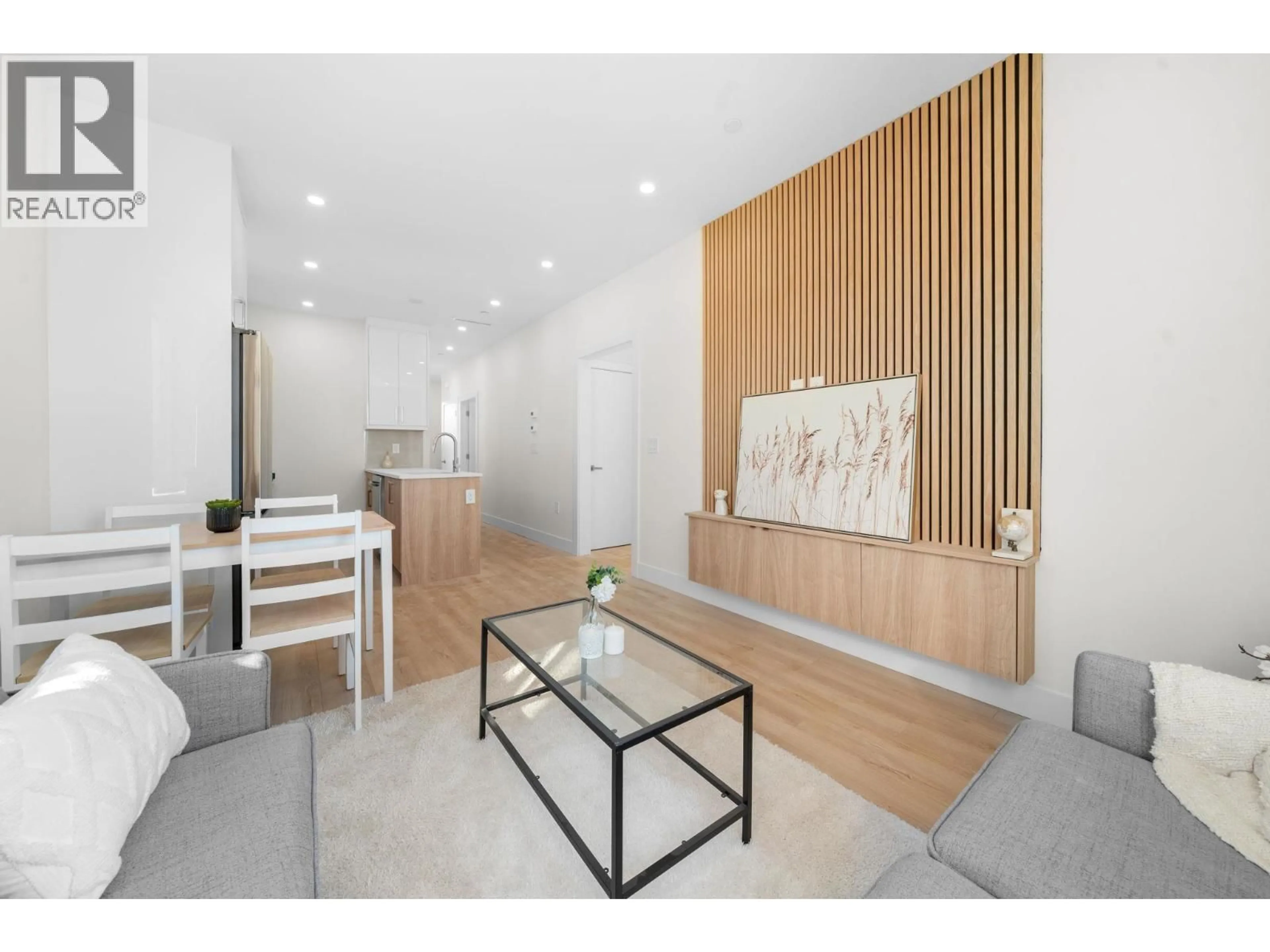 Living room with furniture, wood/laminate floor for 2 - 3583 HAIDA DRIVE, Vancouver British Columbia V5M3Y9