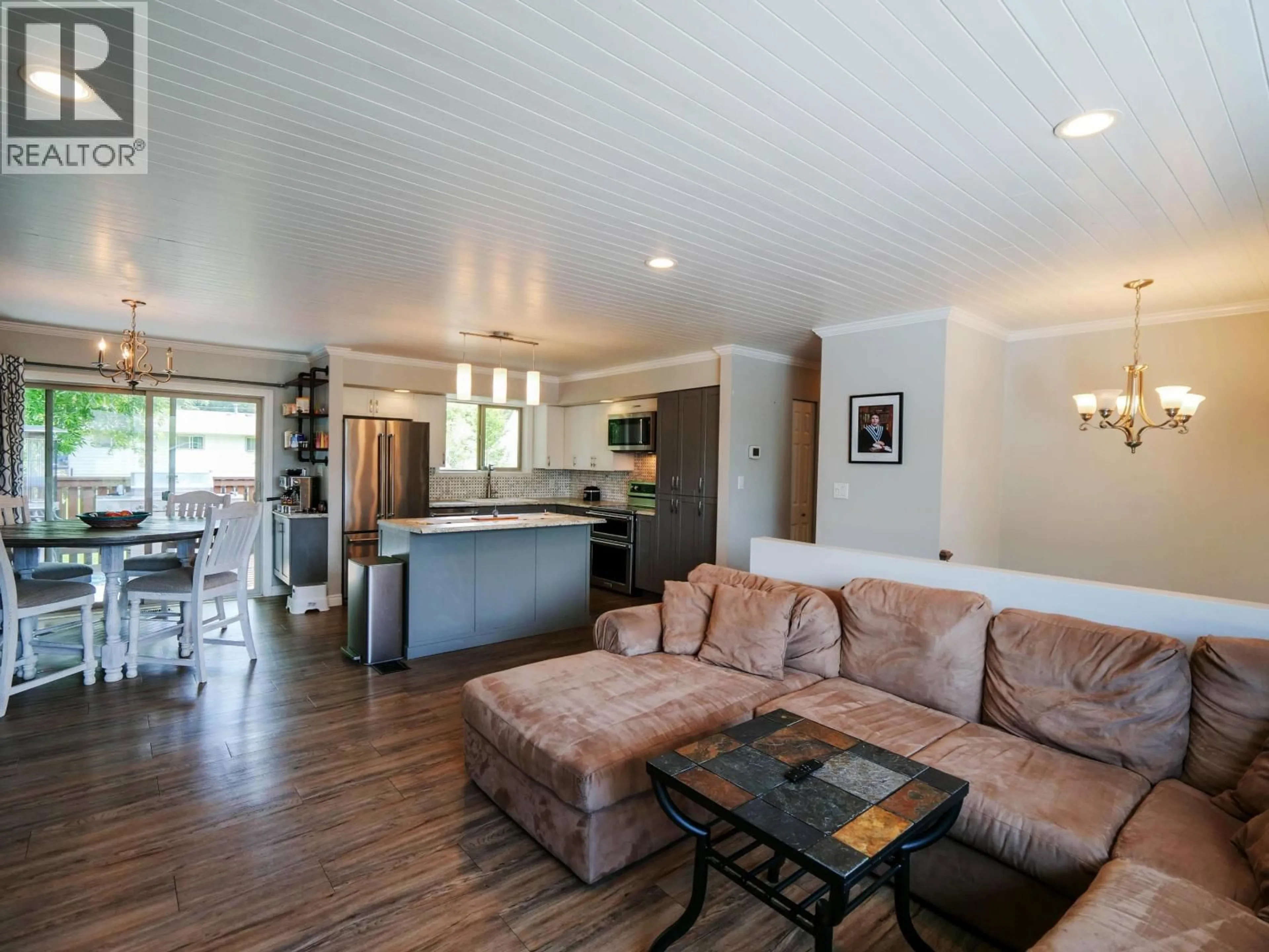 Living room with furniture, wood/laminate floor for 530 NADEAU STREET, Quesnel British Columbia V2J2Z9