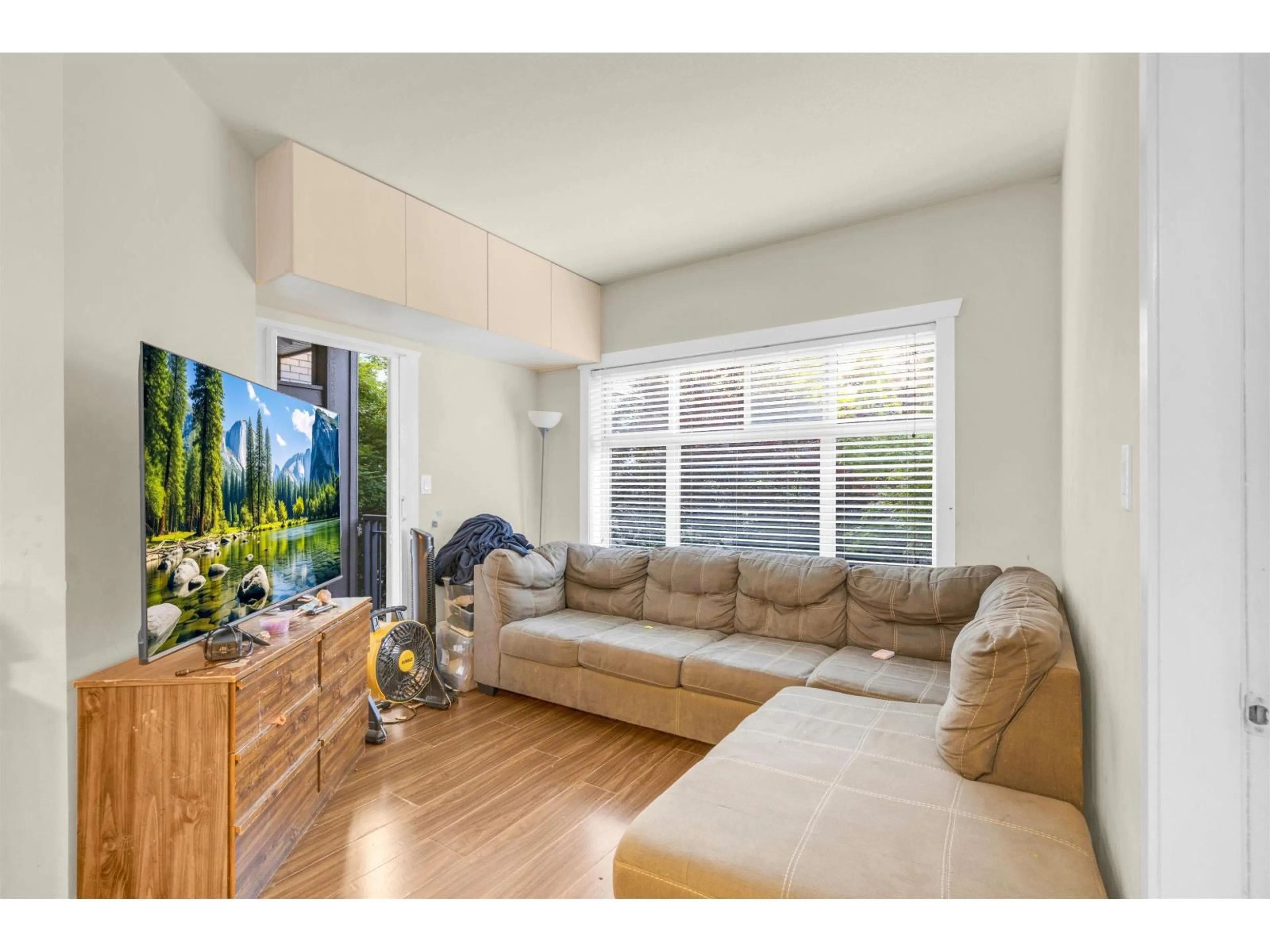 Living room with furniture, wood/laminate floor for 110 - 13468 KING GEORGE BOULEVARD, Surrey British Columbia V3T0H5