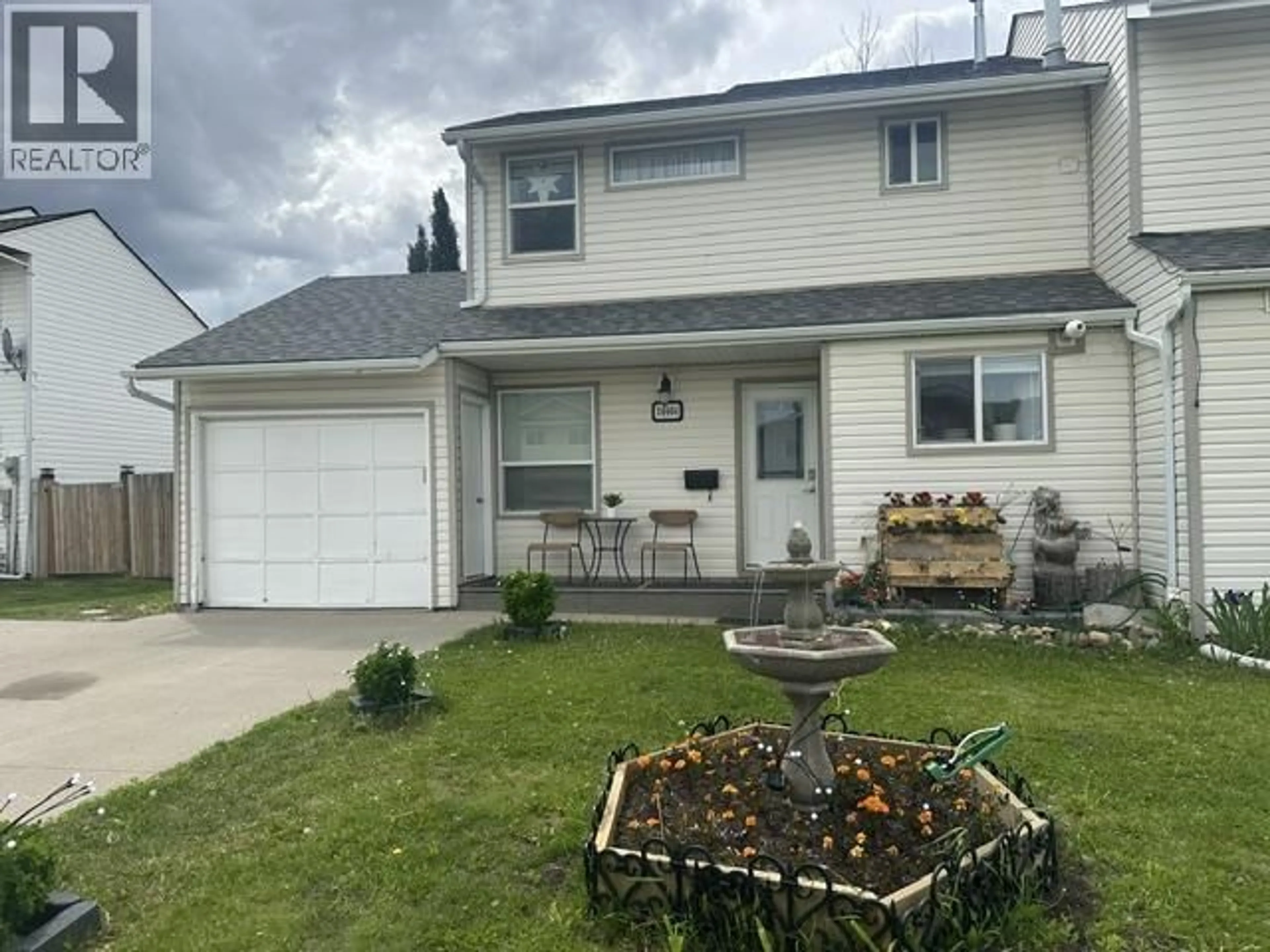 Home with vinyl exterior material, street for 10404 88A STREET, Fort St. John British Columbia V1J5X7
