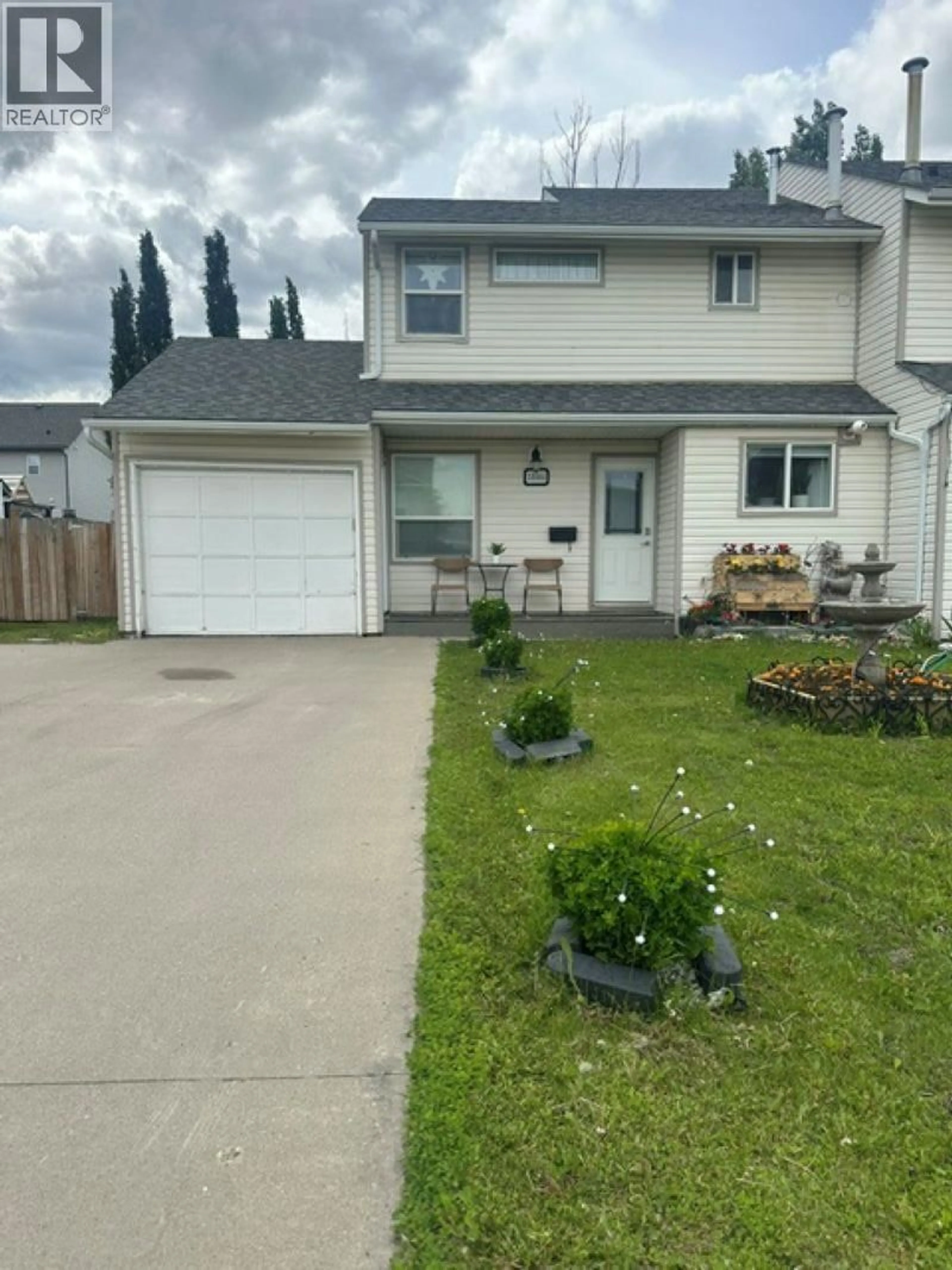 Home with vinyl exterior material, street for 10404 88A STREET, Fort St. John British Columbia V1J5X7