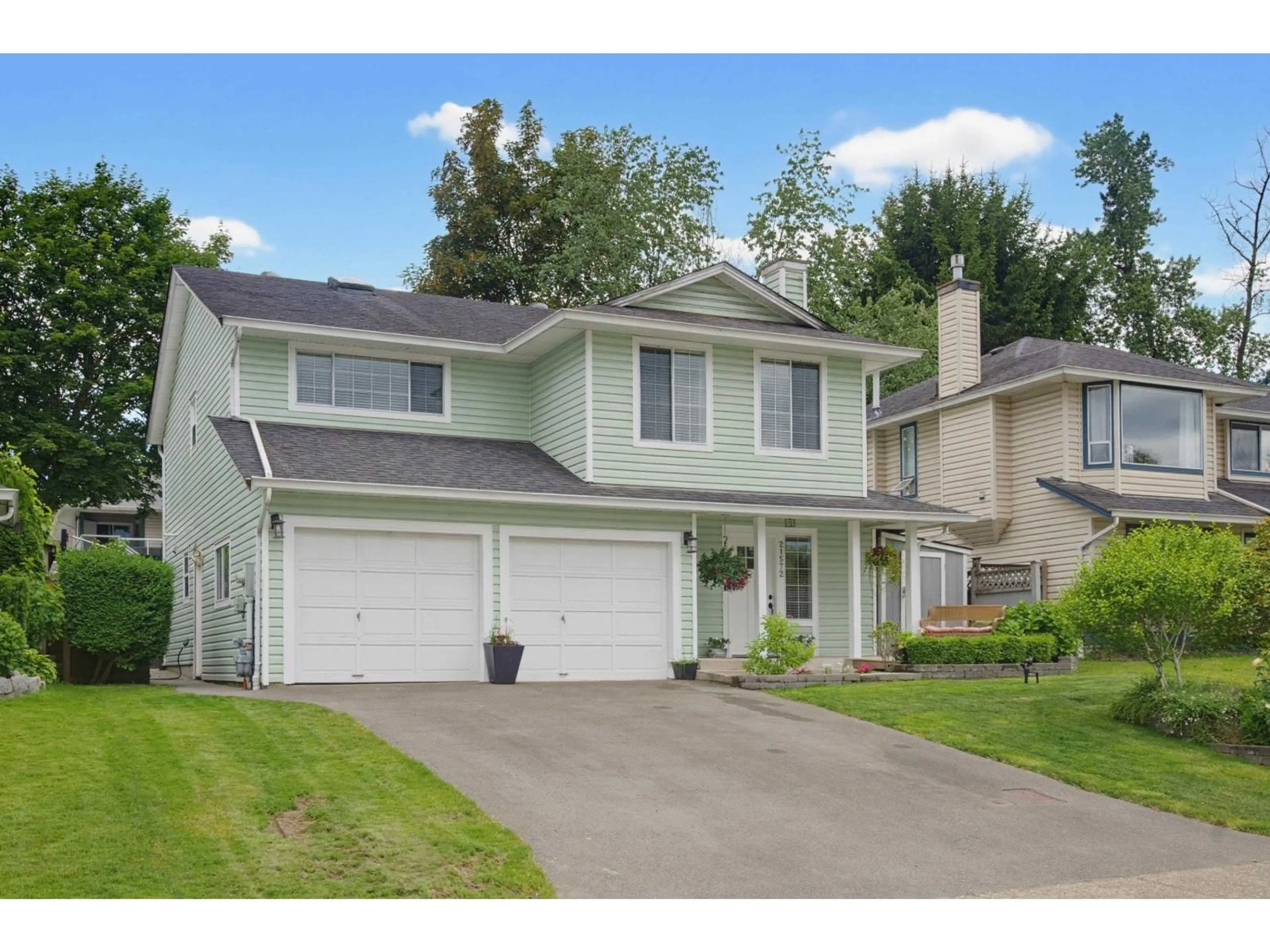 Home with vinyl exterior material, street for 21572 93B AVENUE, Langley British Columbia V1M2A3