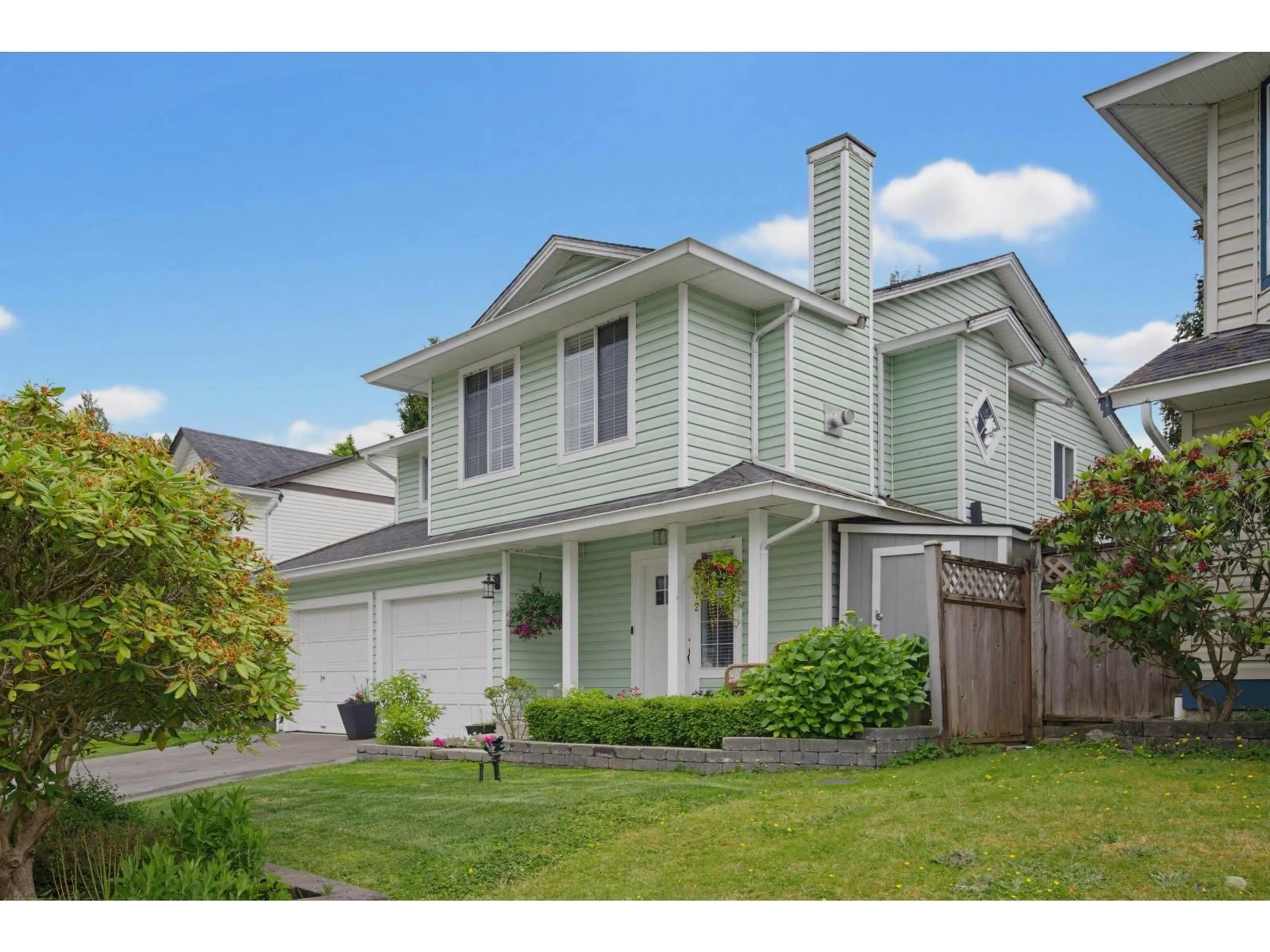 Home with vinyl exterior material, street for 21572 93B AVENUE, Langley British Columbia V1M2A3