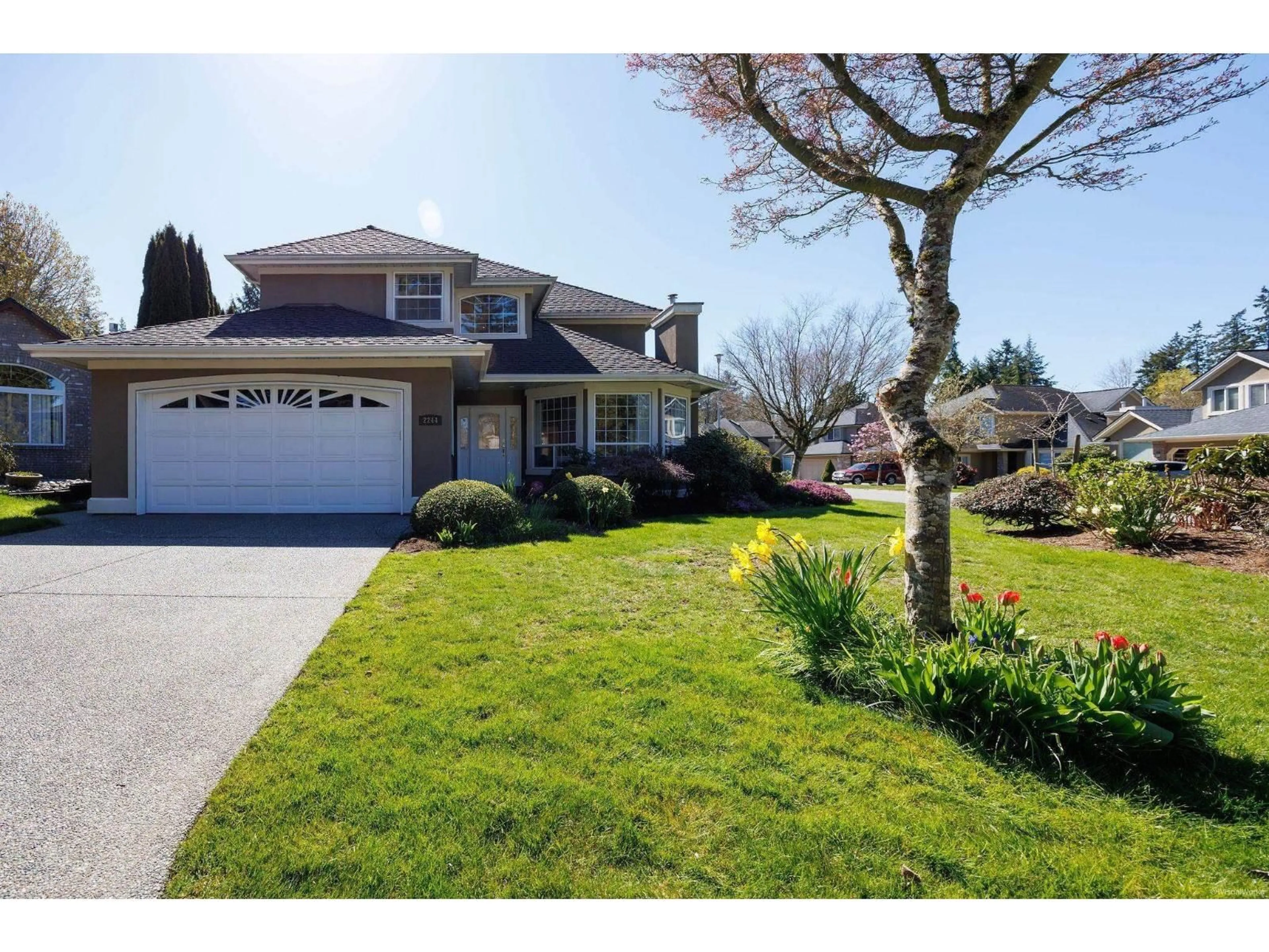 Home with vinyl exterior material, street for 2244 140A STREET, Surrey British Columbia V4A9R8