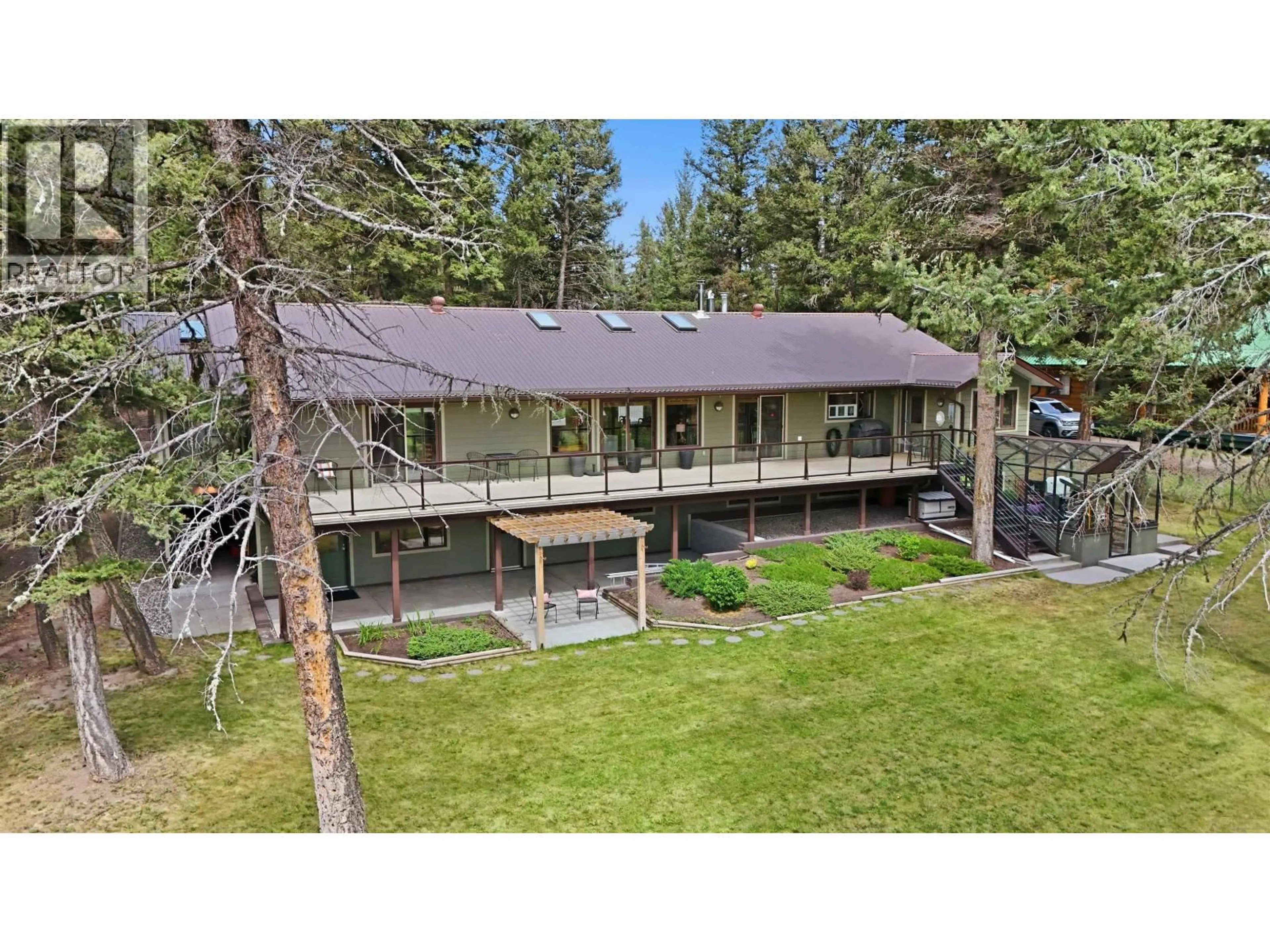 A pic from outside/outdoor area/front of a property/back of a property/a pic from drone, unknown for 5042 GLOINNZUN DRIVE, 100 Mile House British Columbia V0K2Z0
