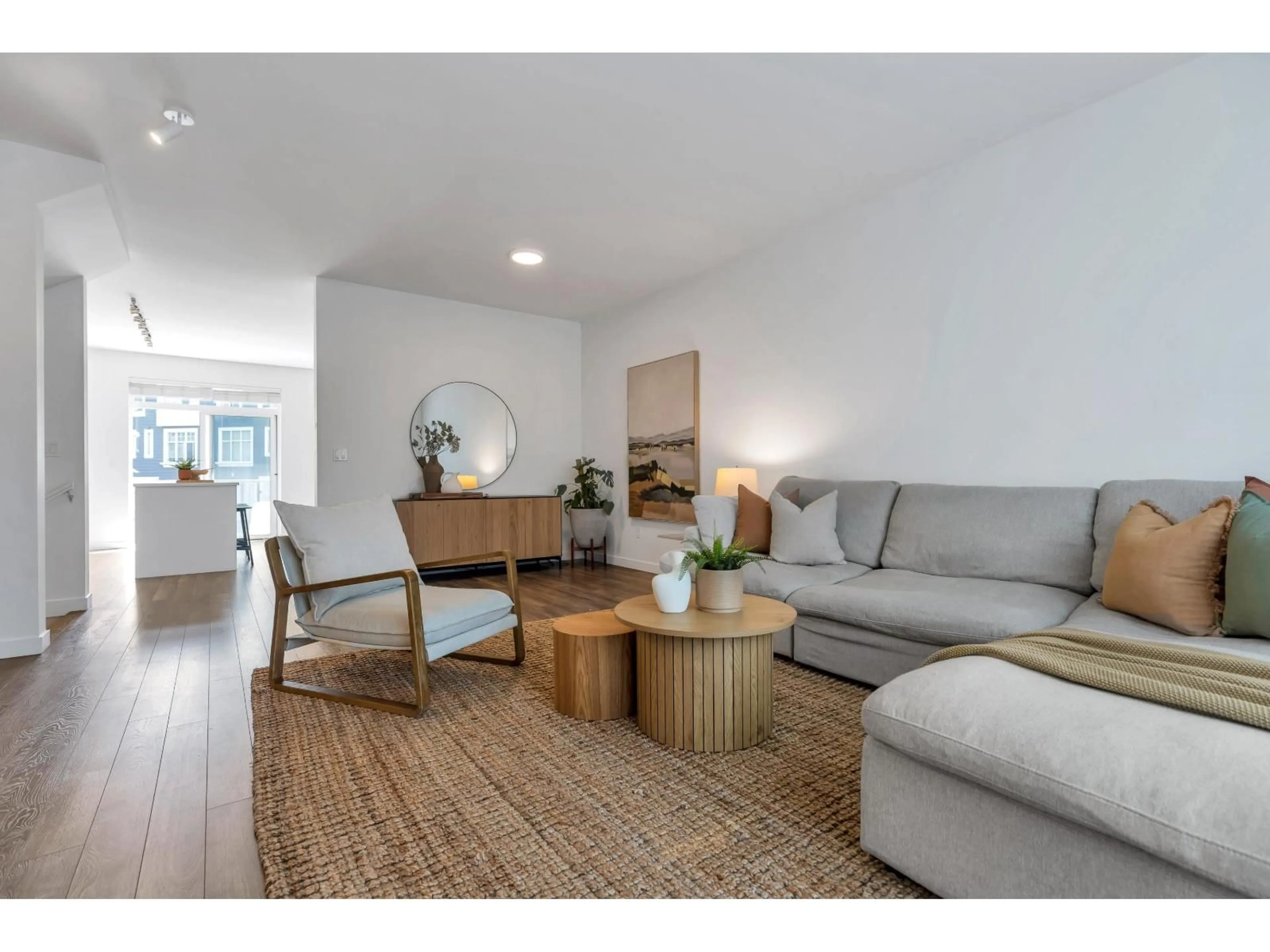 Living room with furniture, wood/laminate floor for 103 - 15268 28 AVENUE, Surrey British Columbia V4P0E8