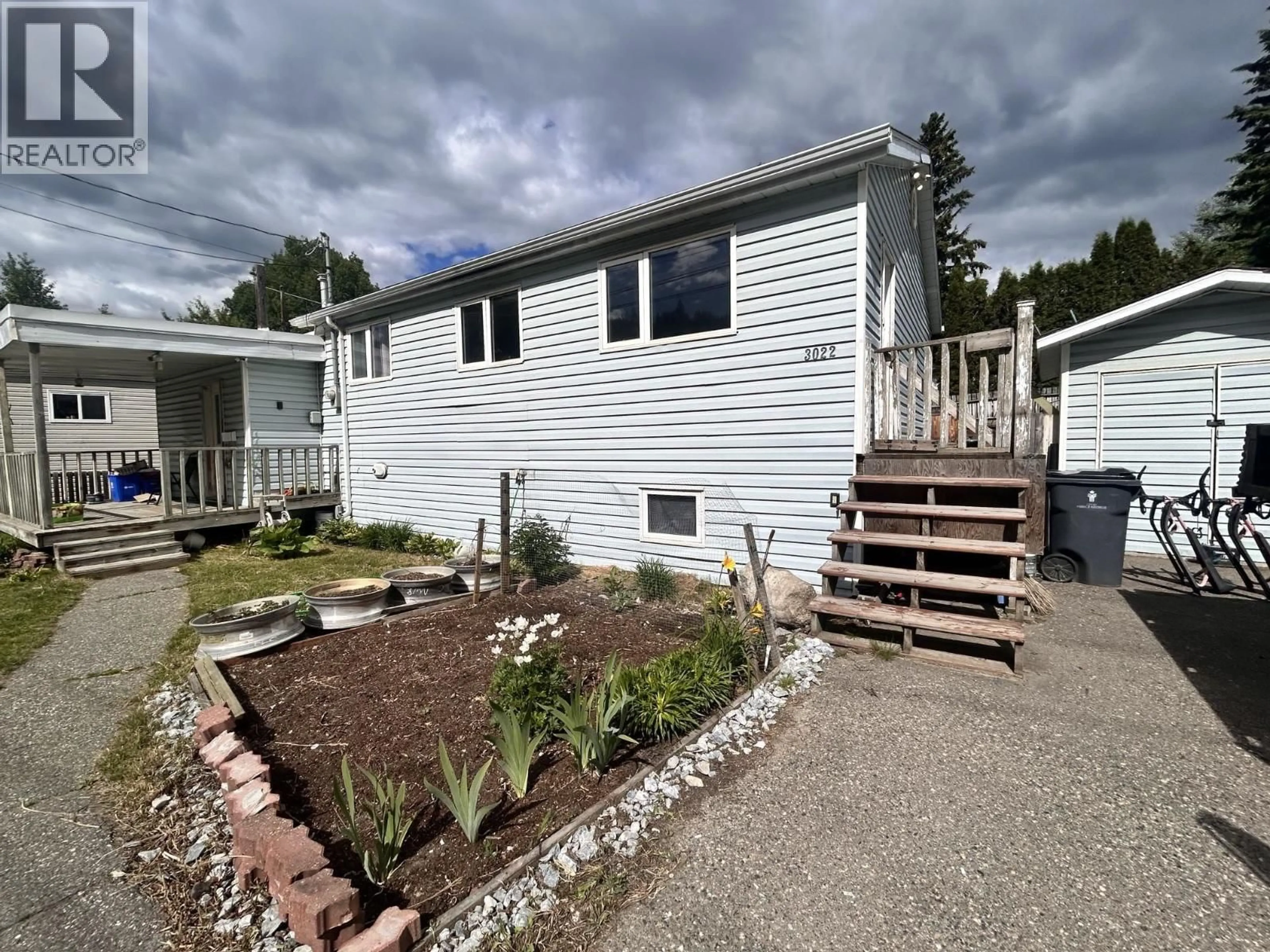 A pic from outside/outdoor area/front of a property/back of a property/a pic from drone, unknown for 3022 HART HIGHWAY, Prince George British Columbia V2K3X9