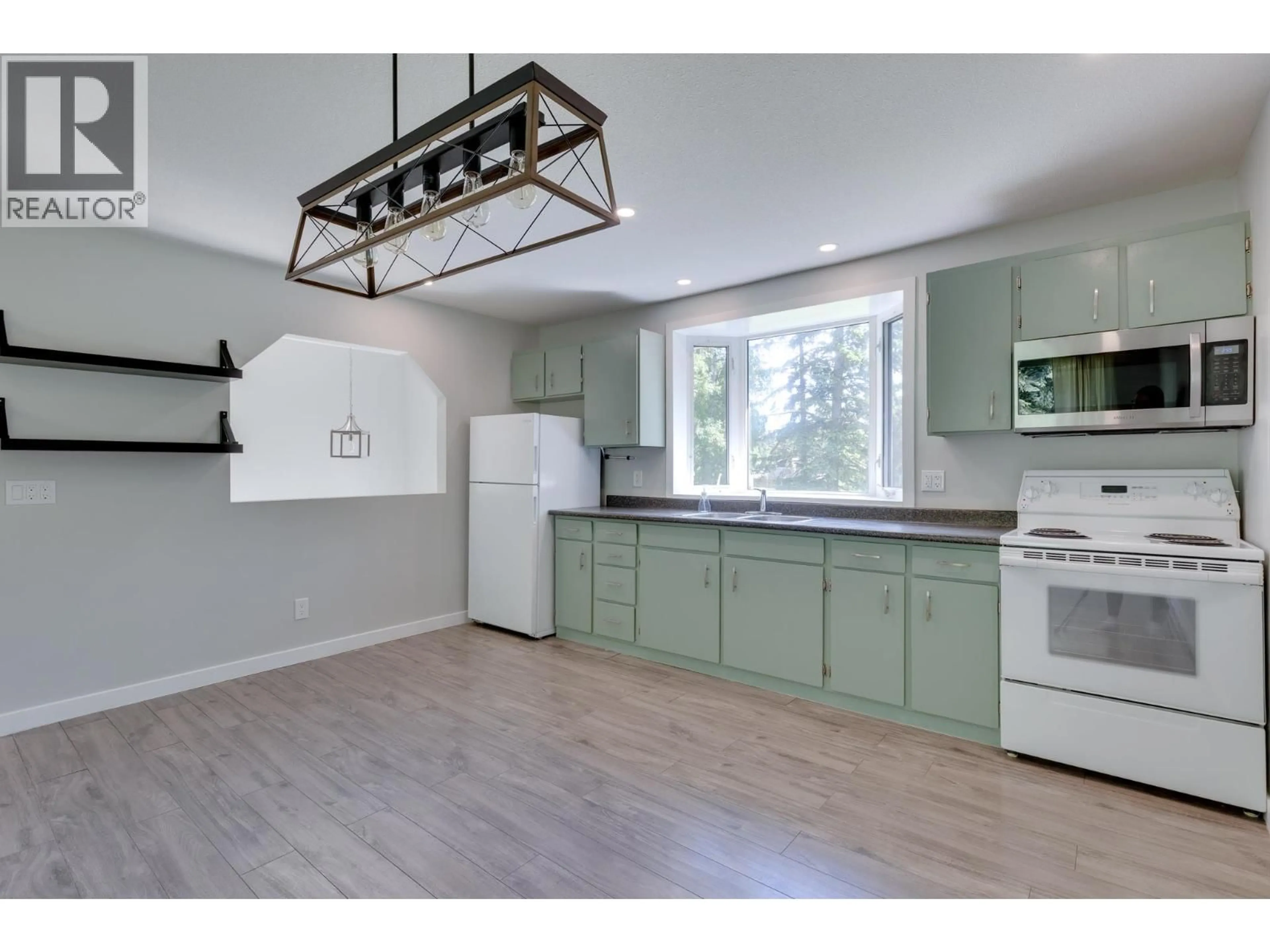 Open concept kitchen, wood/laminate floor for 3667 WINSLOW DRIVE, Prince George British Columbia V2K1W3