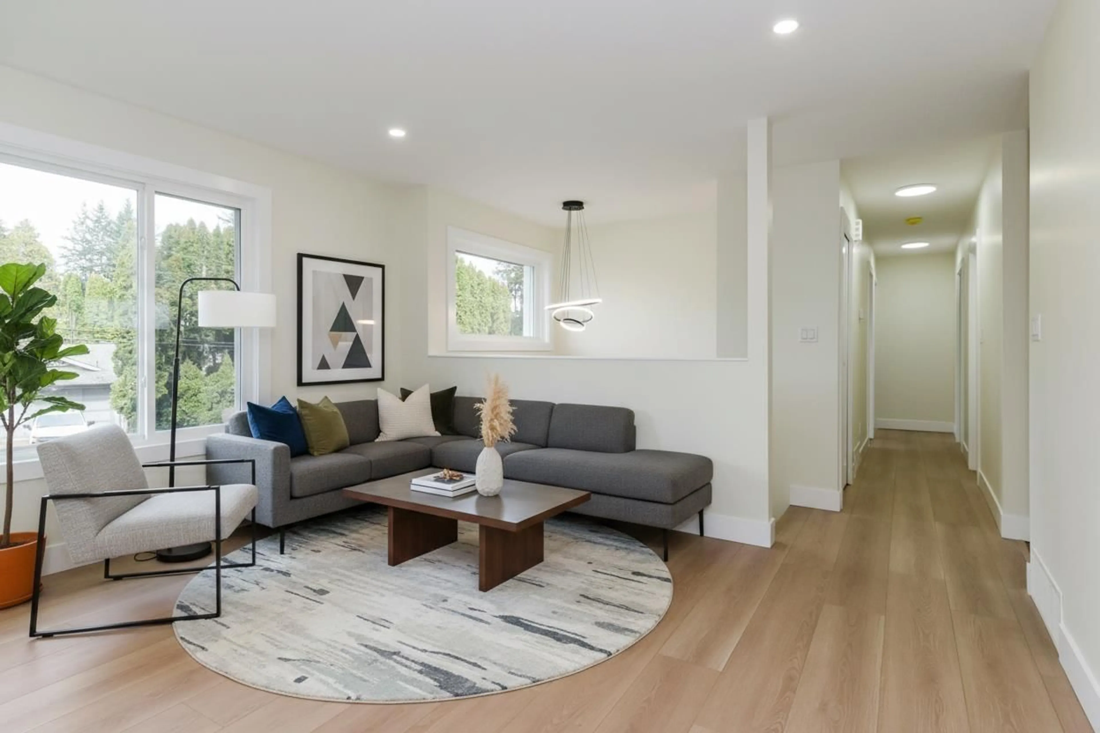 Living room with furniture, wood/laminate floor for 34630 IMMEL STREET, Abbotsford British Columbia V2S4T7