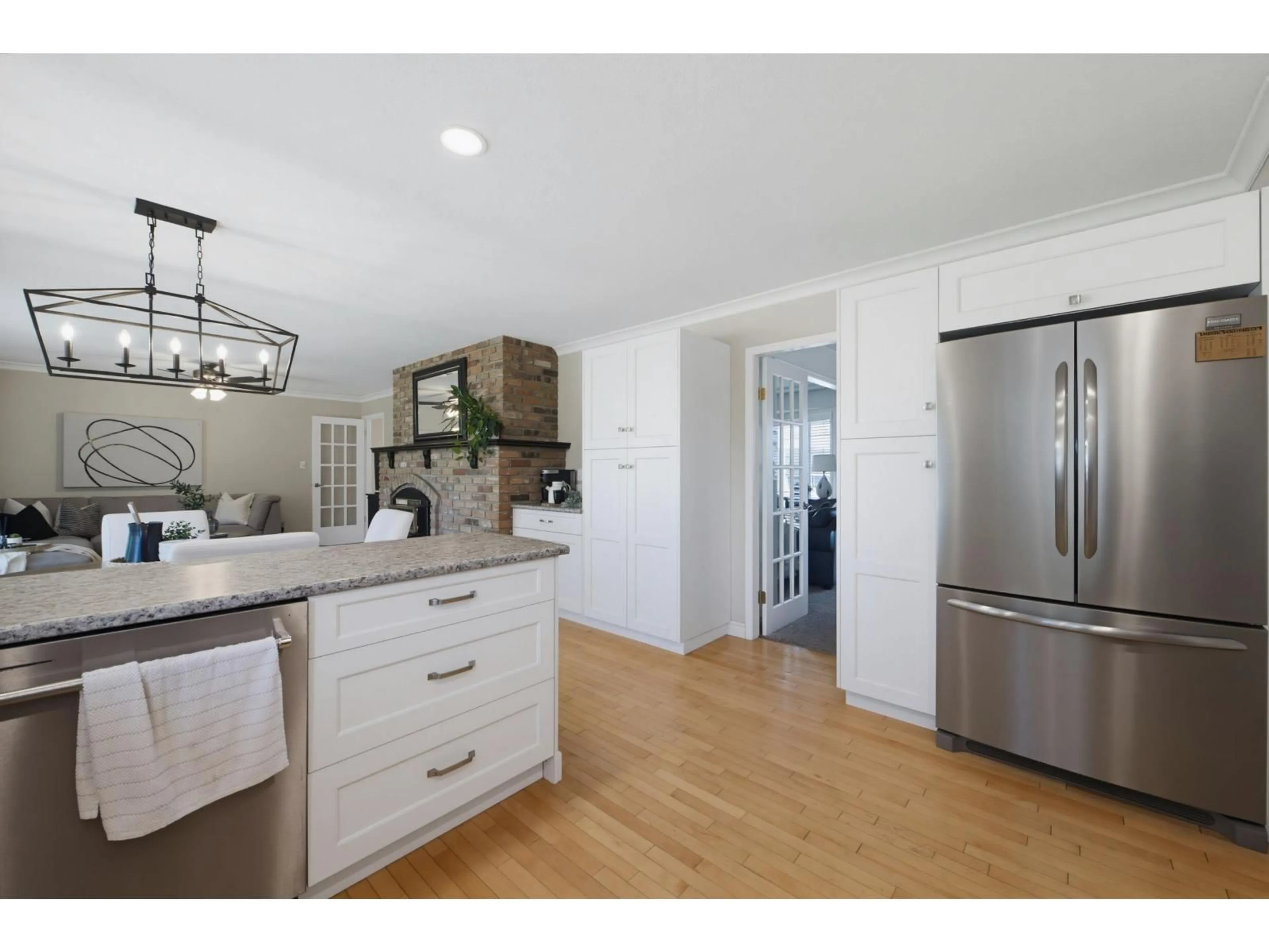 Open concept kitchen, wood/laminate floor for 5631 SUNRISE CRESCENT EAST, Surrey British Columbia V3S7M5