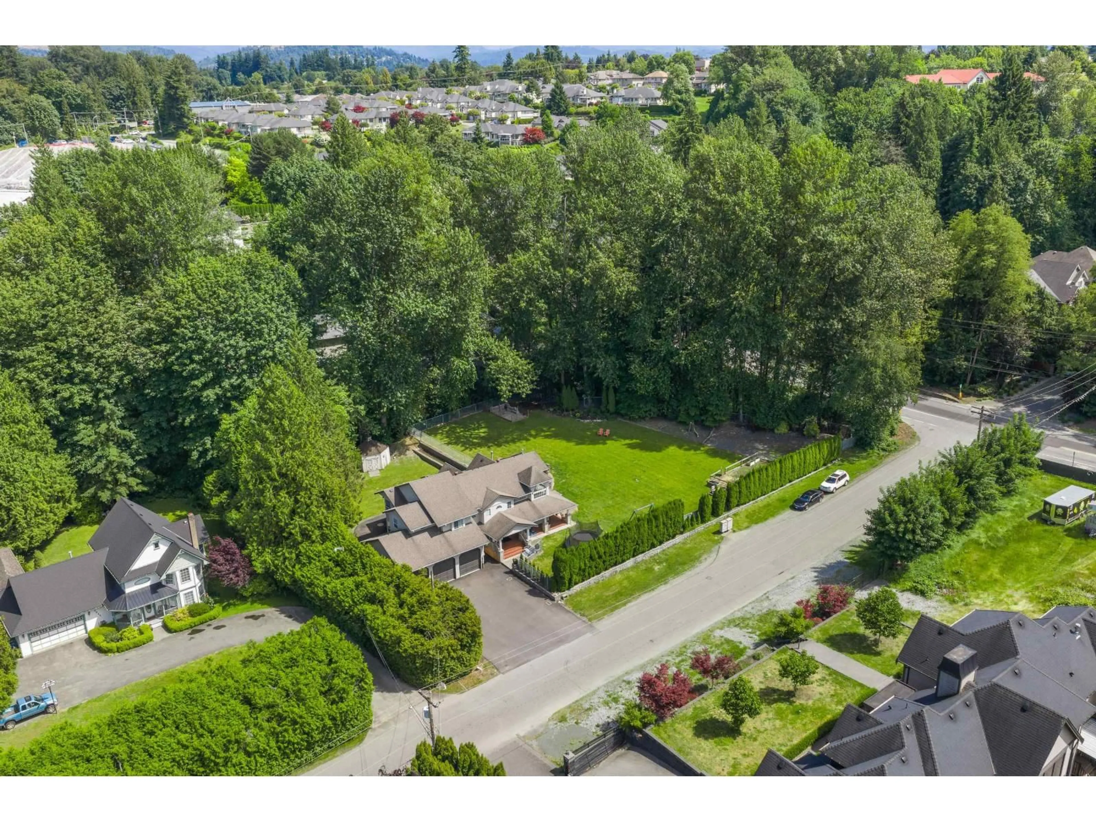 A pic from outside/outdoor area/front of a property/back of a property/a pic from drone, mountain view for 4024 PRAIRIE STREET, Abbotsford British Columbia V4X1X2