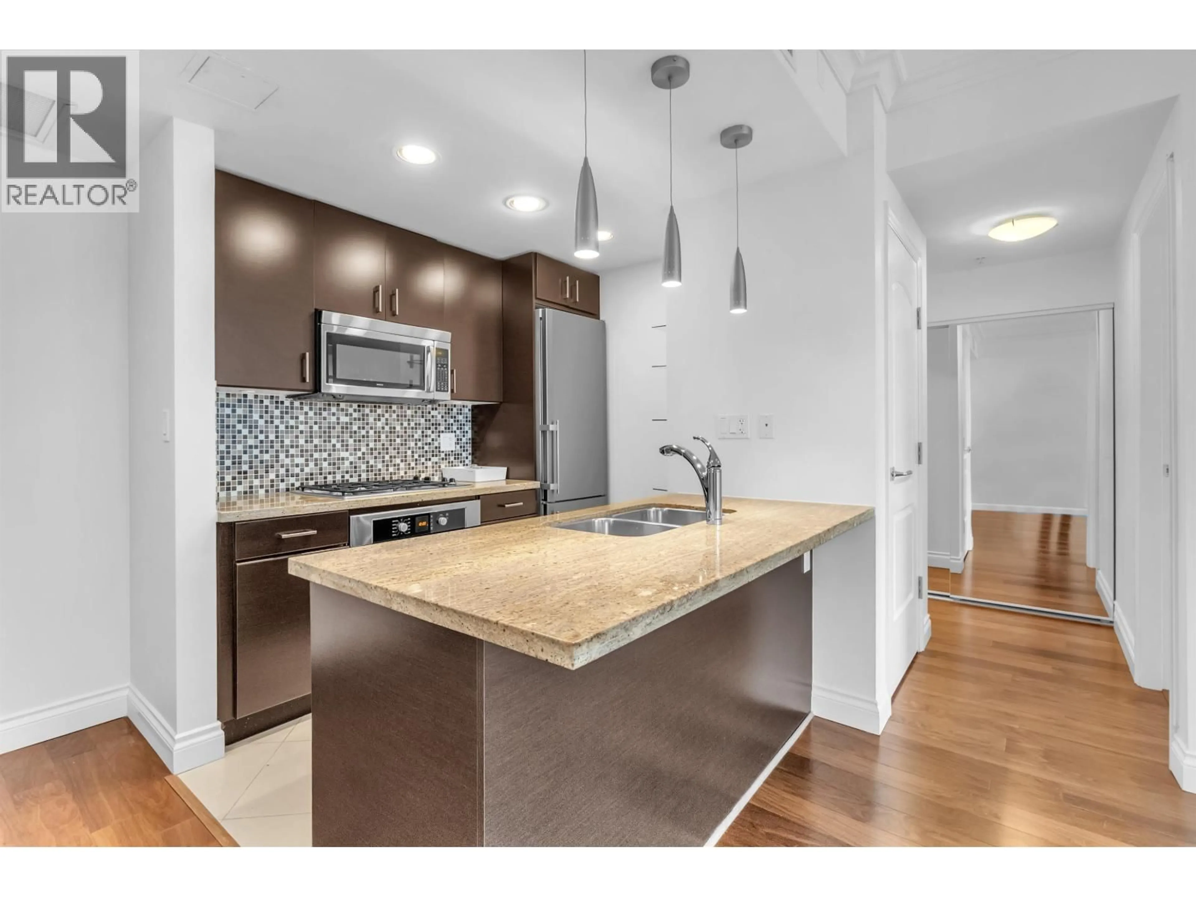 Open concept kitchen, unknown for 901 - 172 VICTORY SHIP WAY, North Vancouver British Columbia V7L0B5