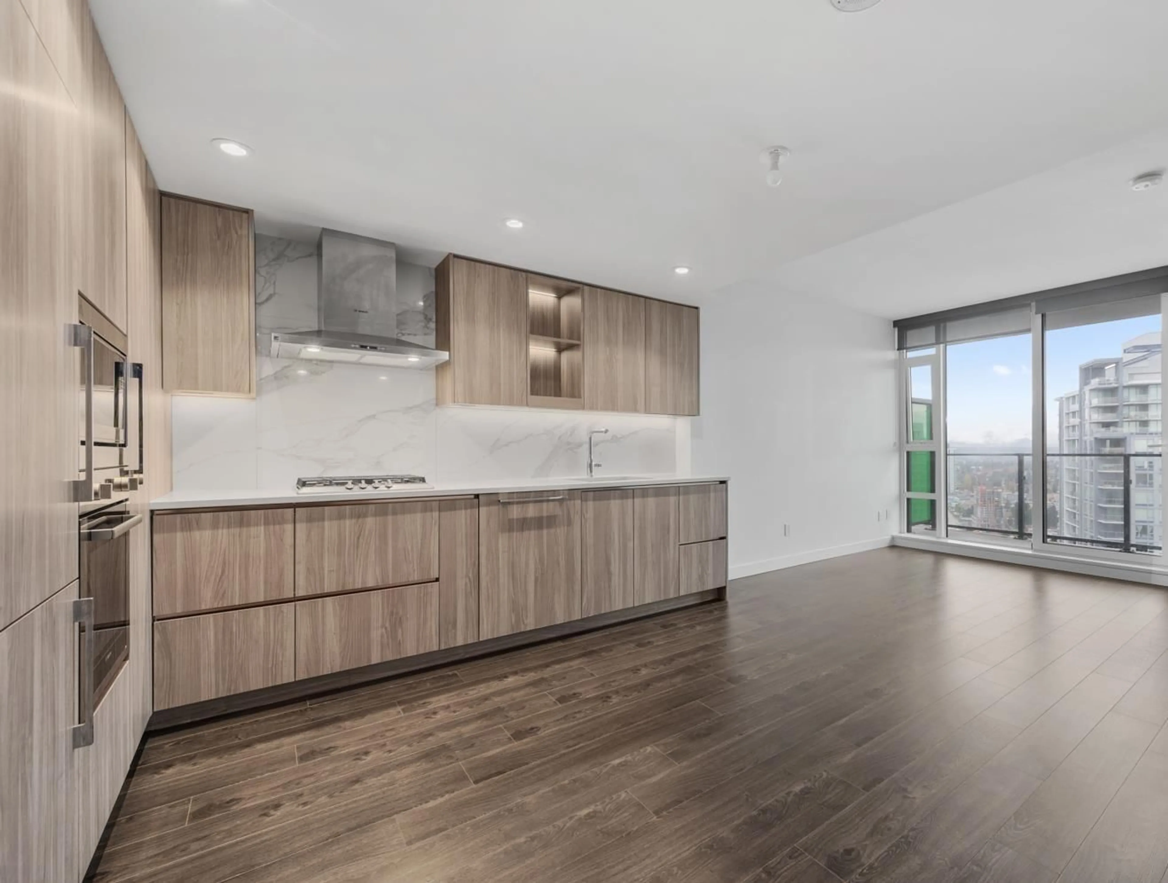 Open concept kitchen, wood/laminate floor for 3506 - 9887 WHALLEY BOULEVARD, Surrey British Columbia V3T0P4