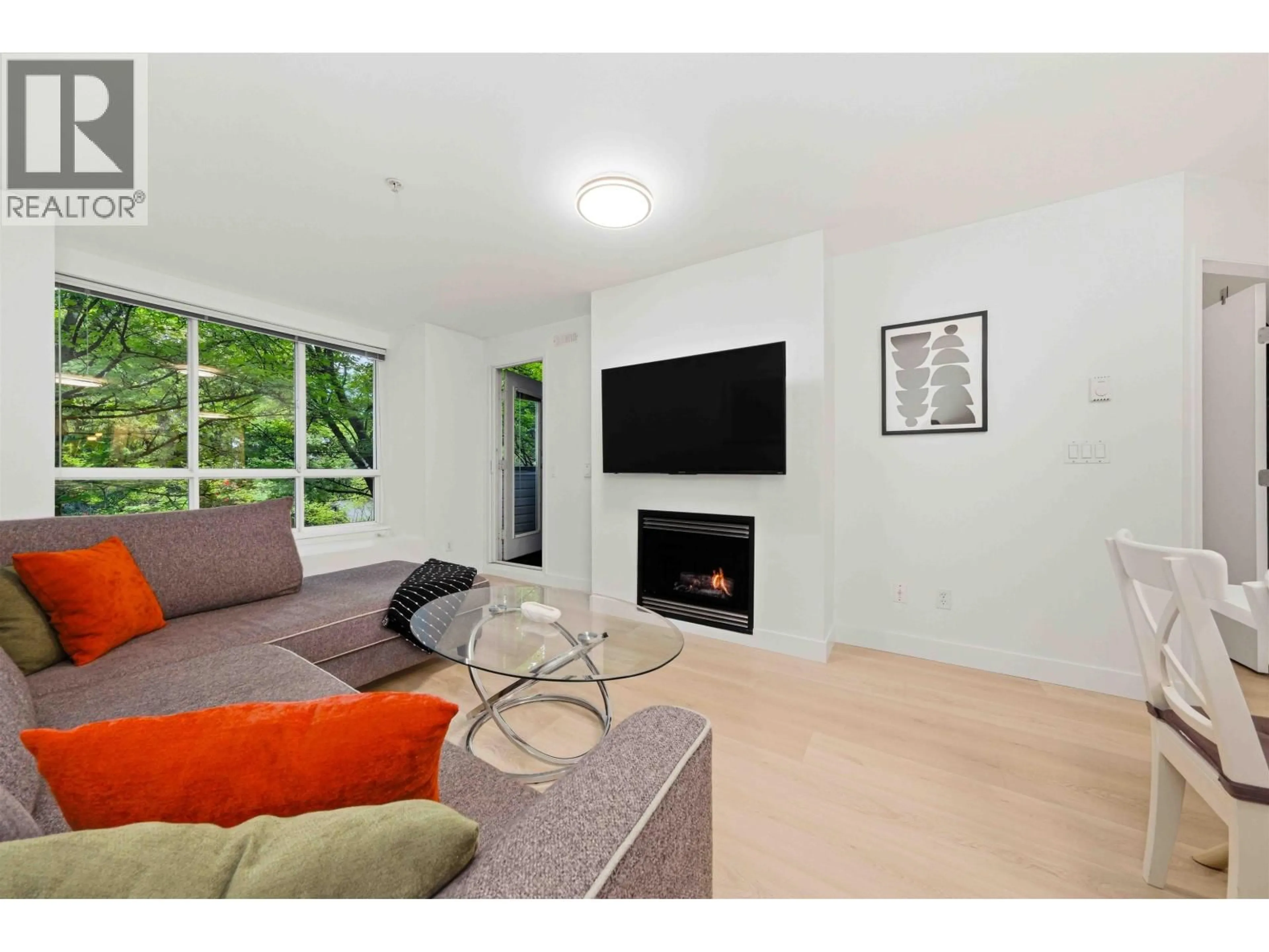 Living room with furniture, unknown for 201 - 1111 LYNN VALLEY ROAD, North Vancouver British Columbia V7J3V4