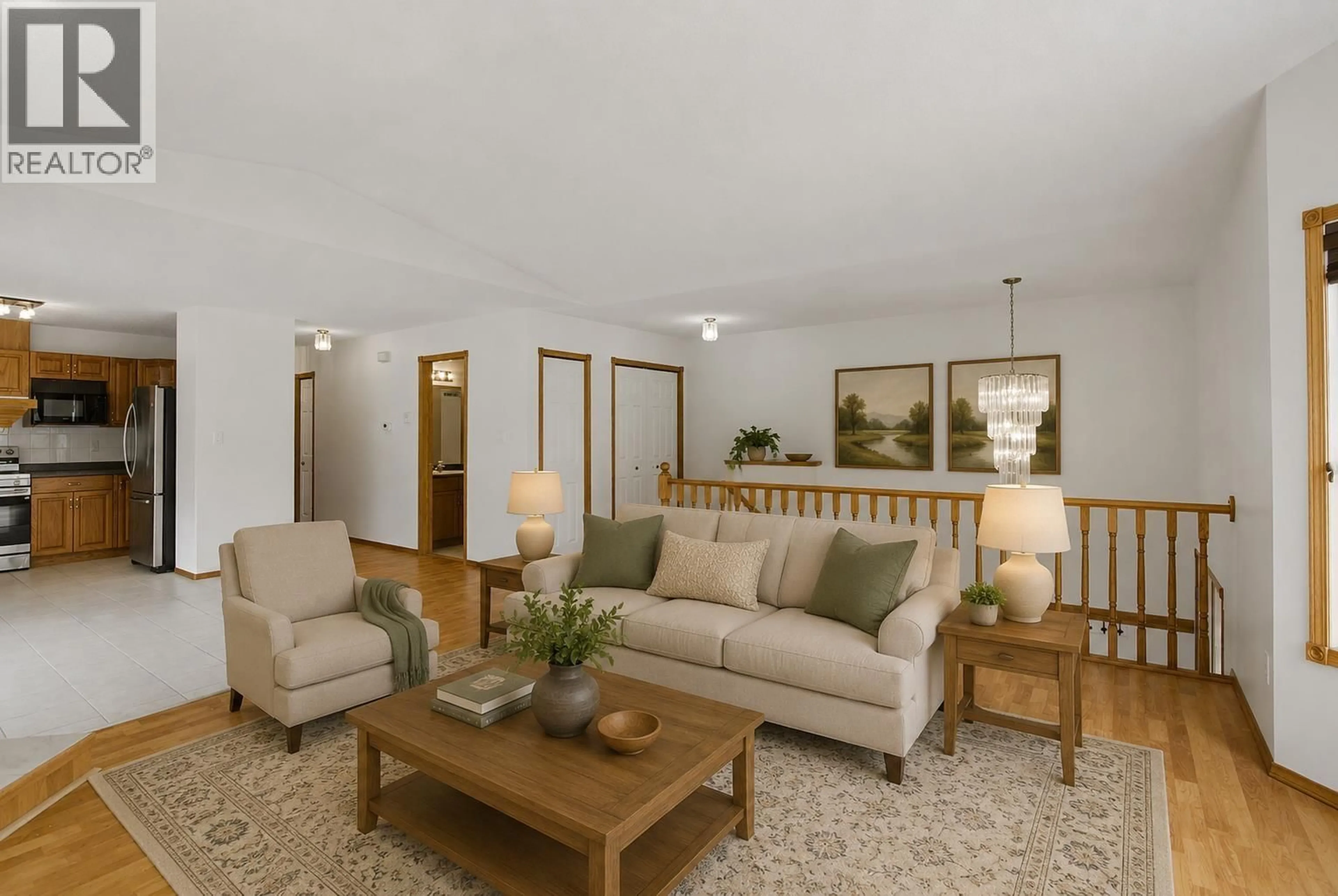 Living room with furniture, wood/laminate floor for 108 - 6450 DAWSON ROAD, Prince George British Columbia V2K5Y4