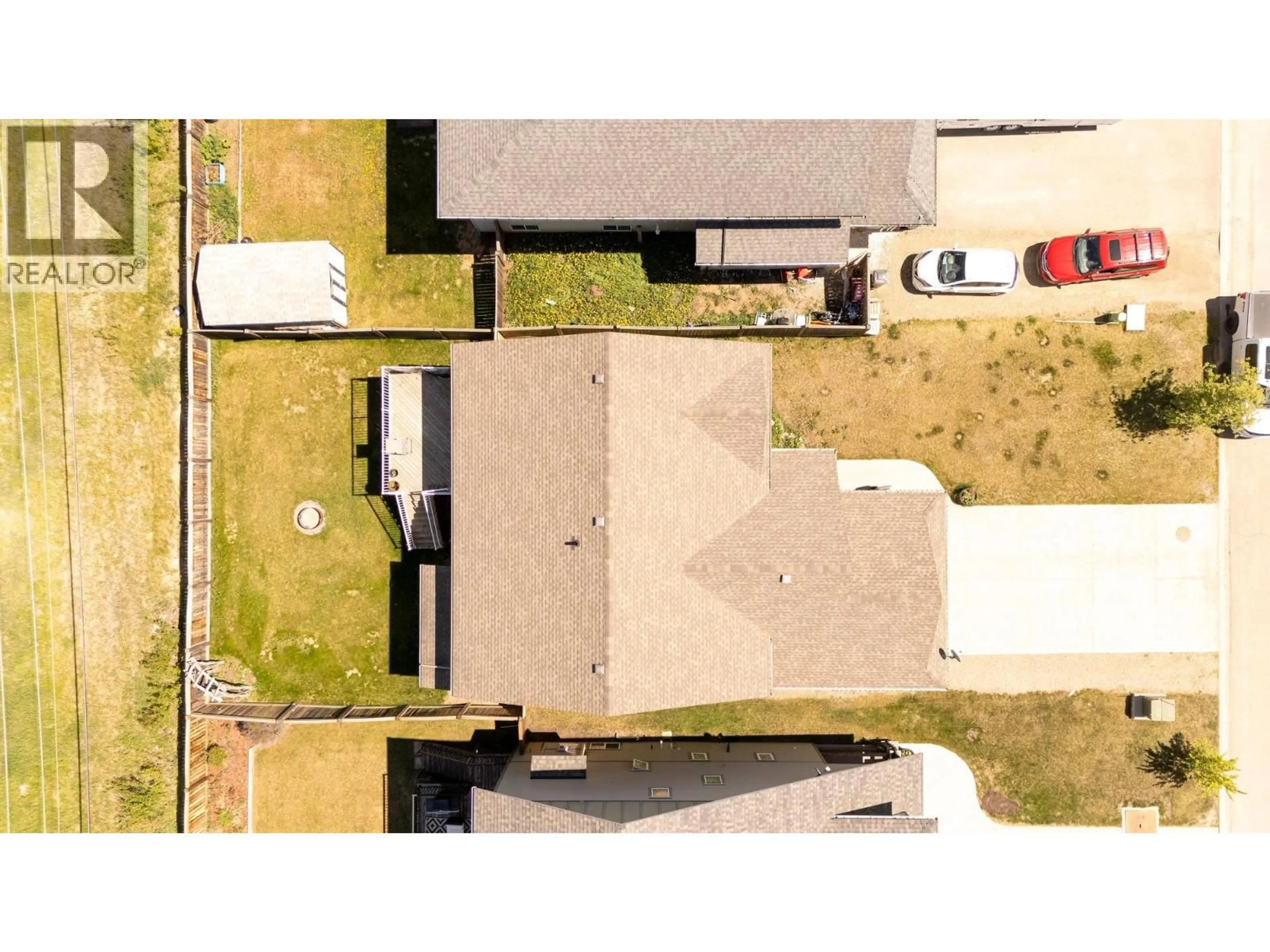 A pic from outside/outdoor area/front of a property/back of a property/a pic from drone, street for 9704 118 AVENUE, Fort St. John British Columbia V1J0E9