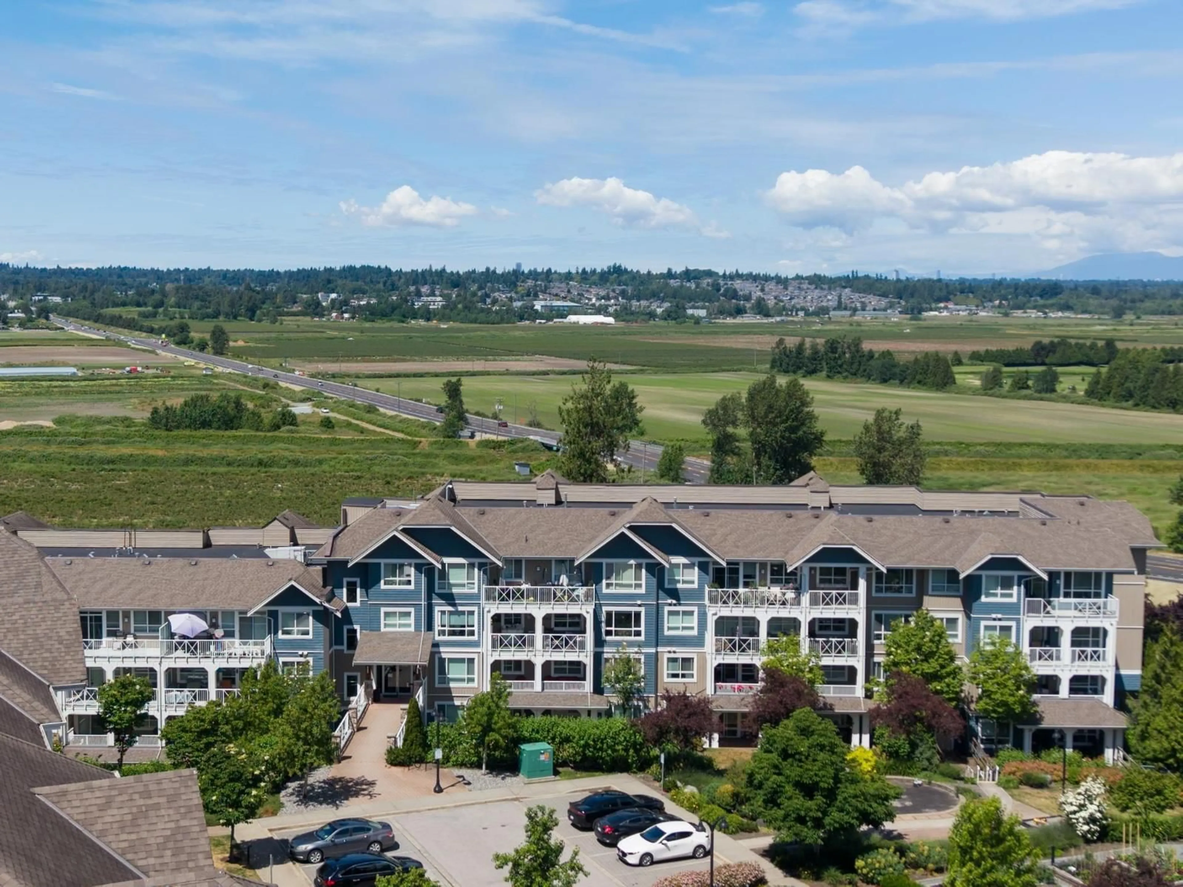 A pic from outside/outdoor area/front of a property/back of a property/a pic from drone, mountain view for 416 - 16380 64 AVENUE, Surrey British Columbia V3S6X6