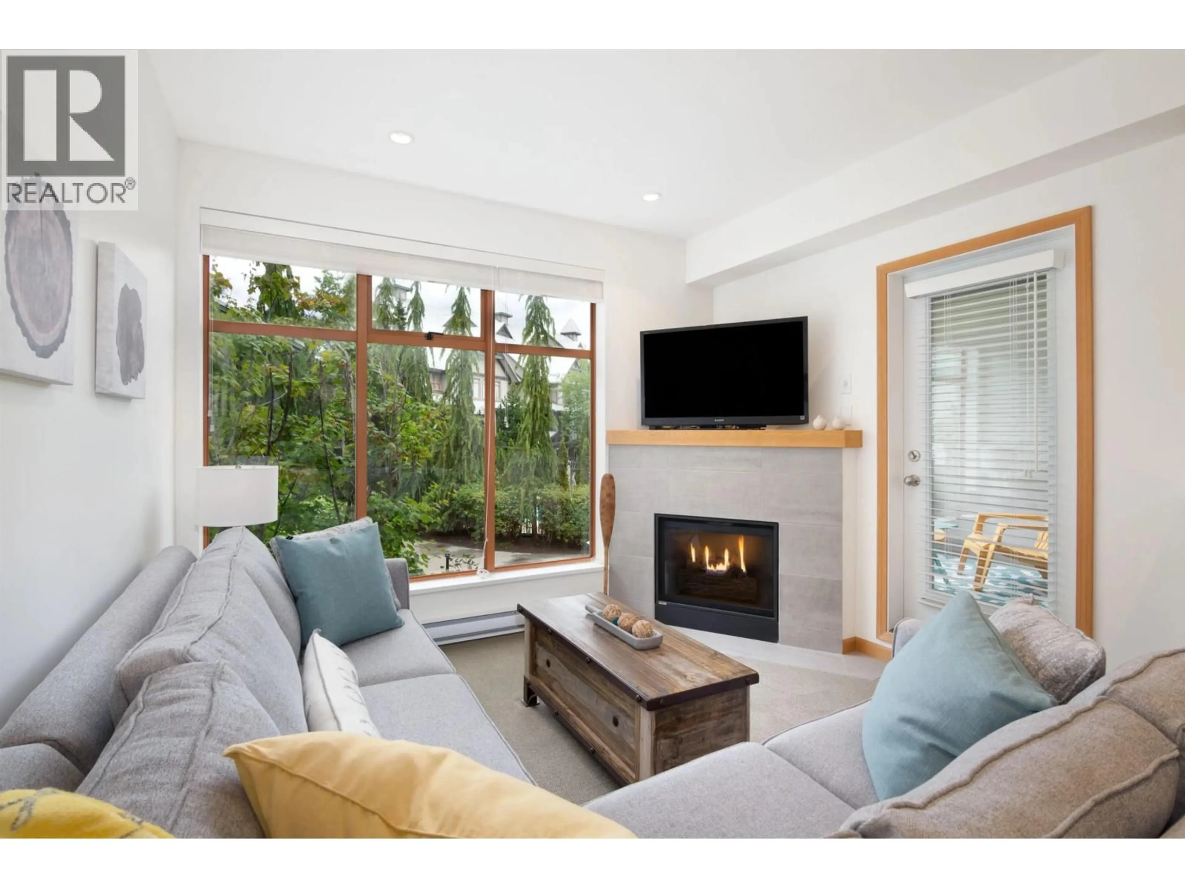 Living room with furniture, wood/laminate floor for 18 - 4355 NORTHLANDS BOULEVARD, Whistler British Columbia V8E1C3