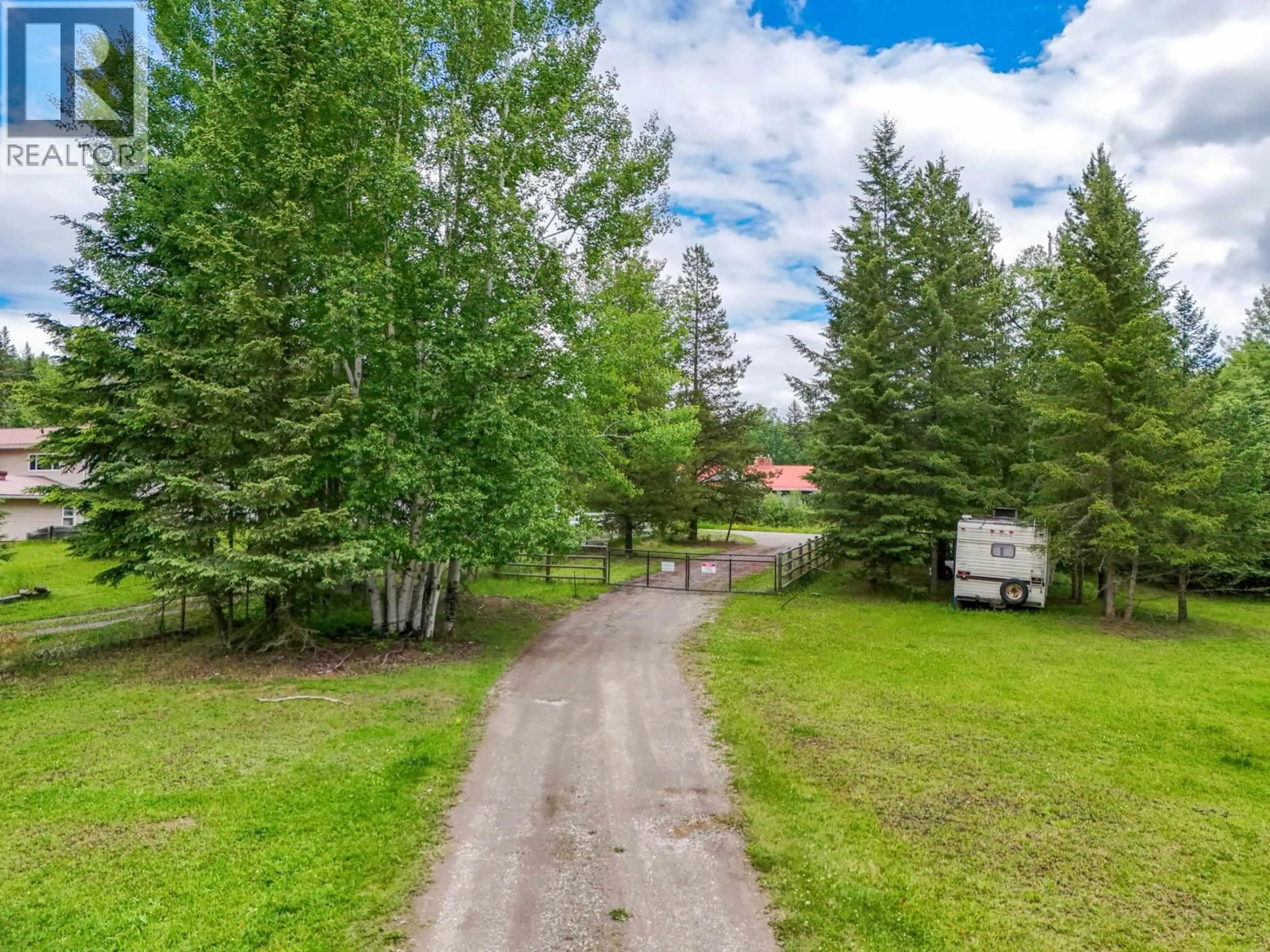 A pic from outside/outdoor area/front of a property/back of a property/a pic from drone, forest/trees view for 3222 HAYMAN CRESCENT, Quesnel British Columbia V2J6K7