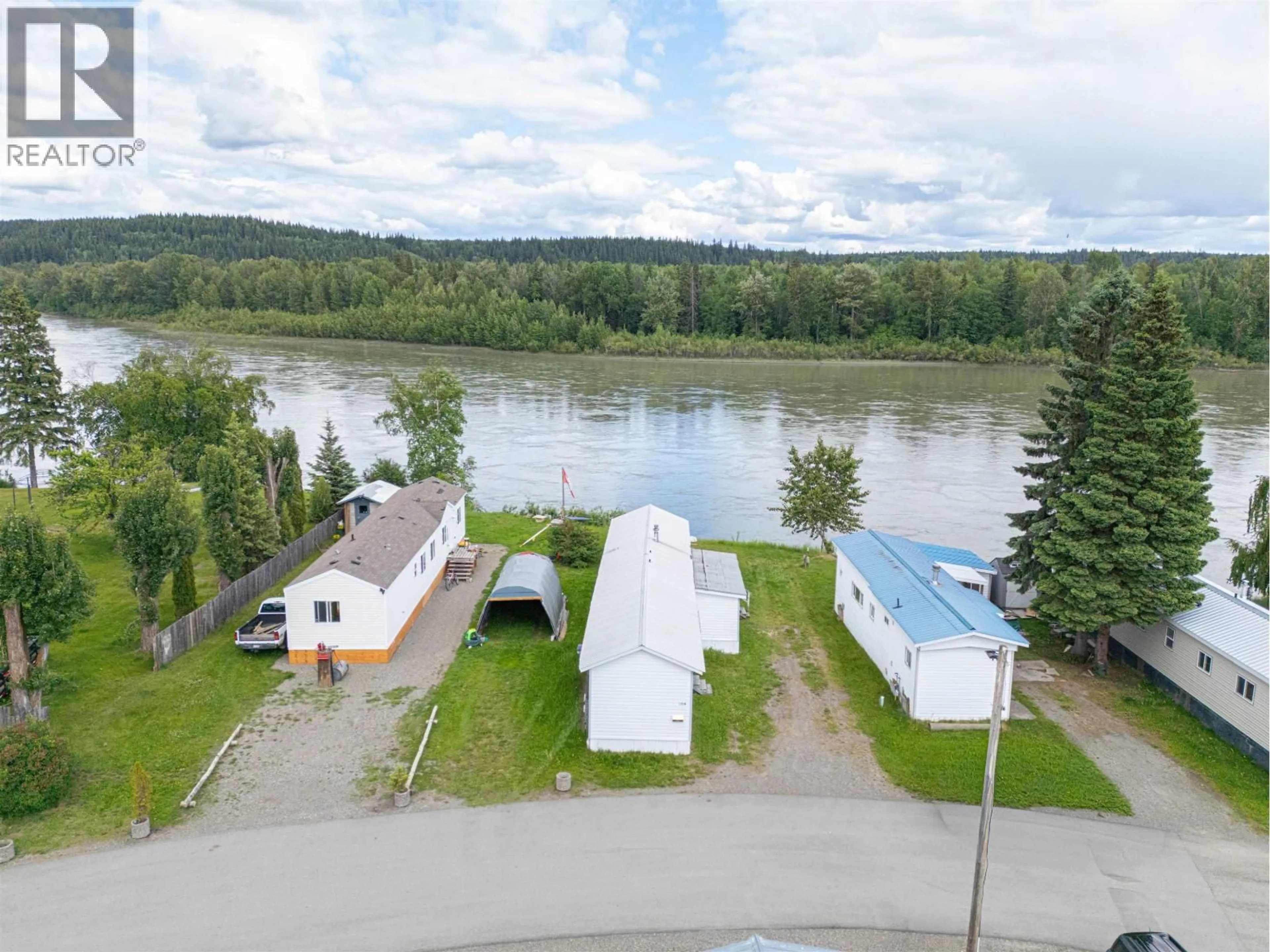A pic from outside/outdoor area/front of a property/back of a property/a pic from drone, water/lake/river/ocean view for 104 - 3730 LANSDOWNE ROAD, Prince George British Columbia V2N2S5