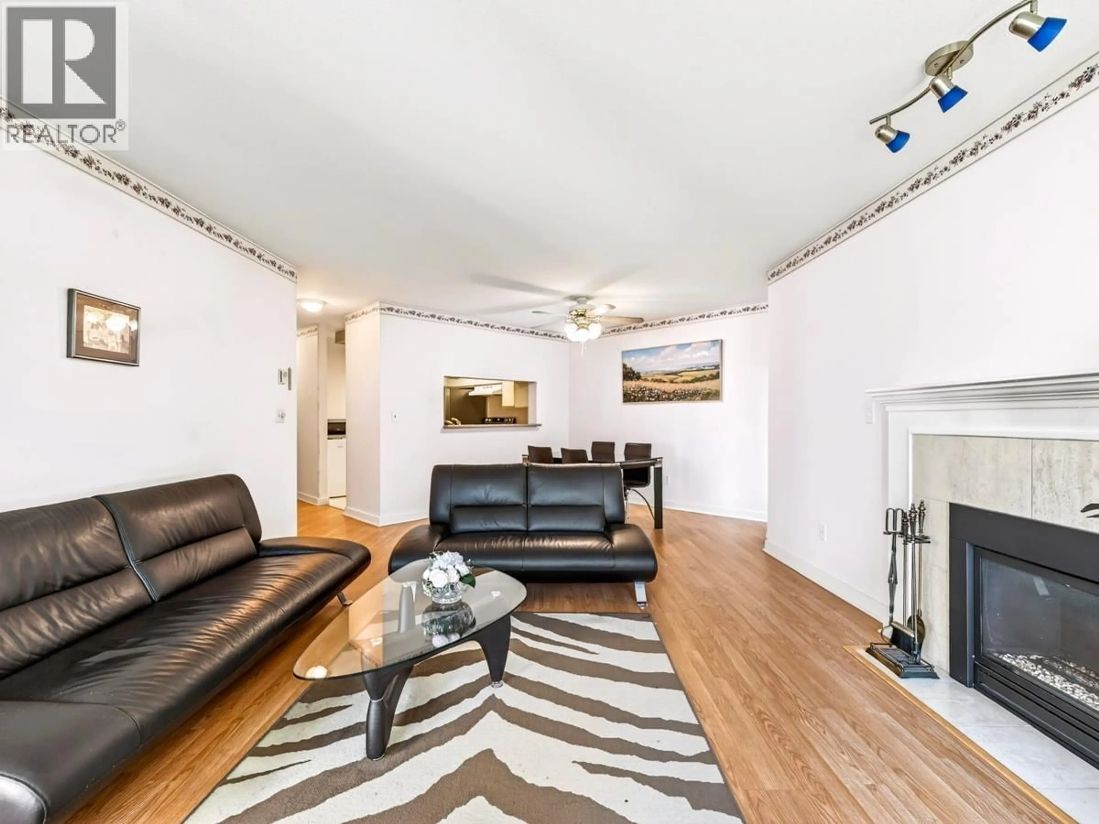 Living room with furniture, wood/laminate floor for 221 - 7435 MOFFATT ROAD, Richmond British Columbia V6Y1X9