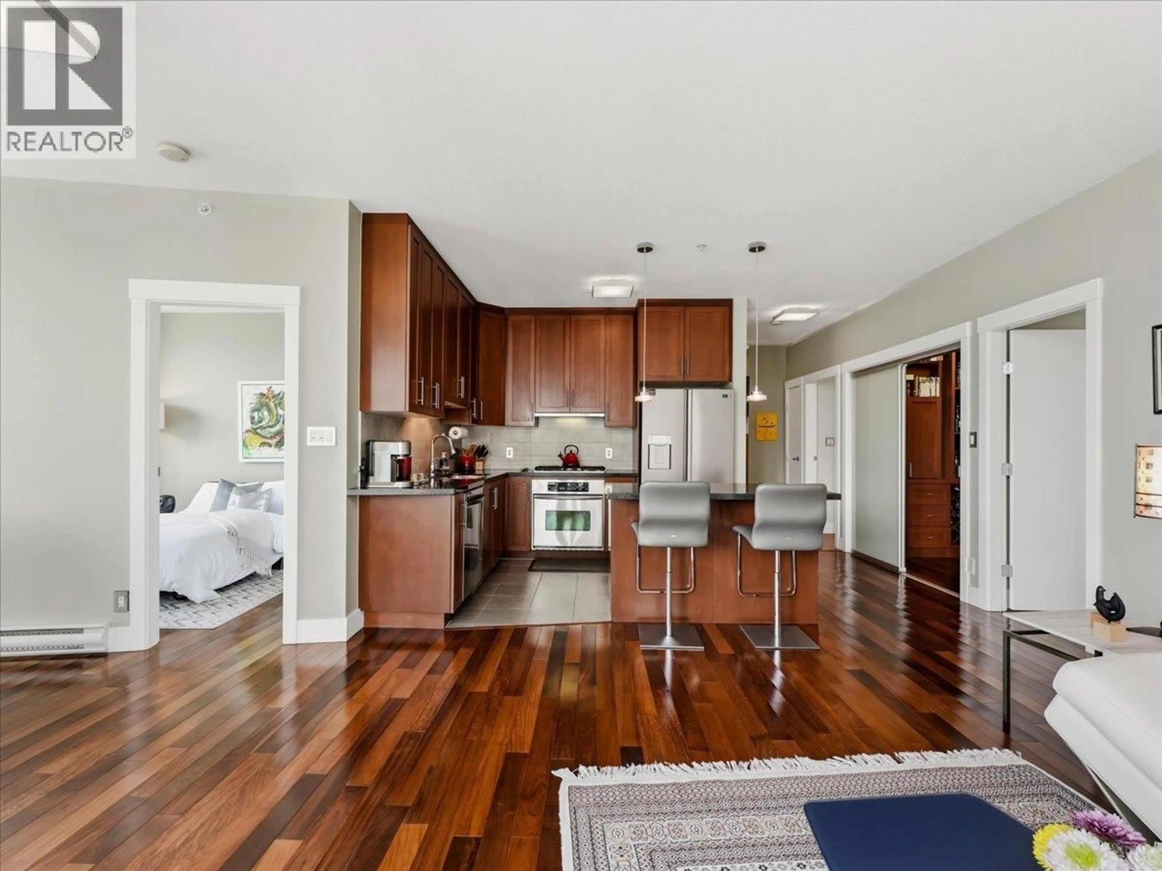 Open concept kitchen, wood/laminate floor for 3301 - 1189 MELVILLE STREET, Vancouver British Columbia V6E4T8