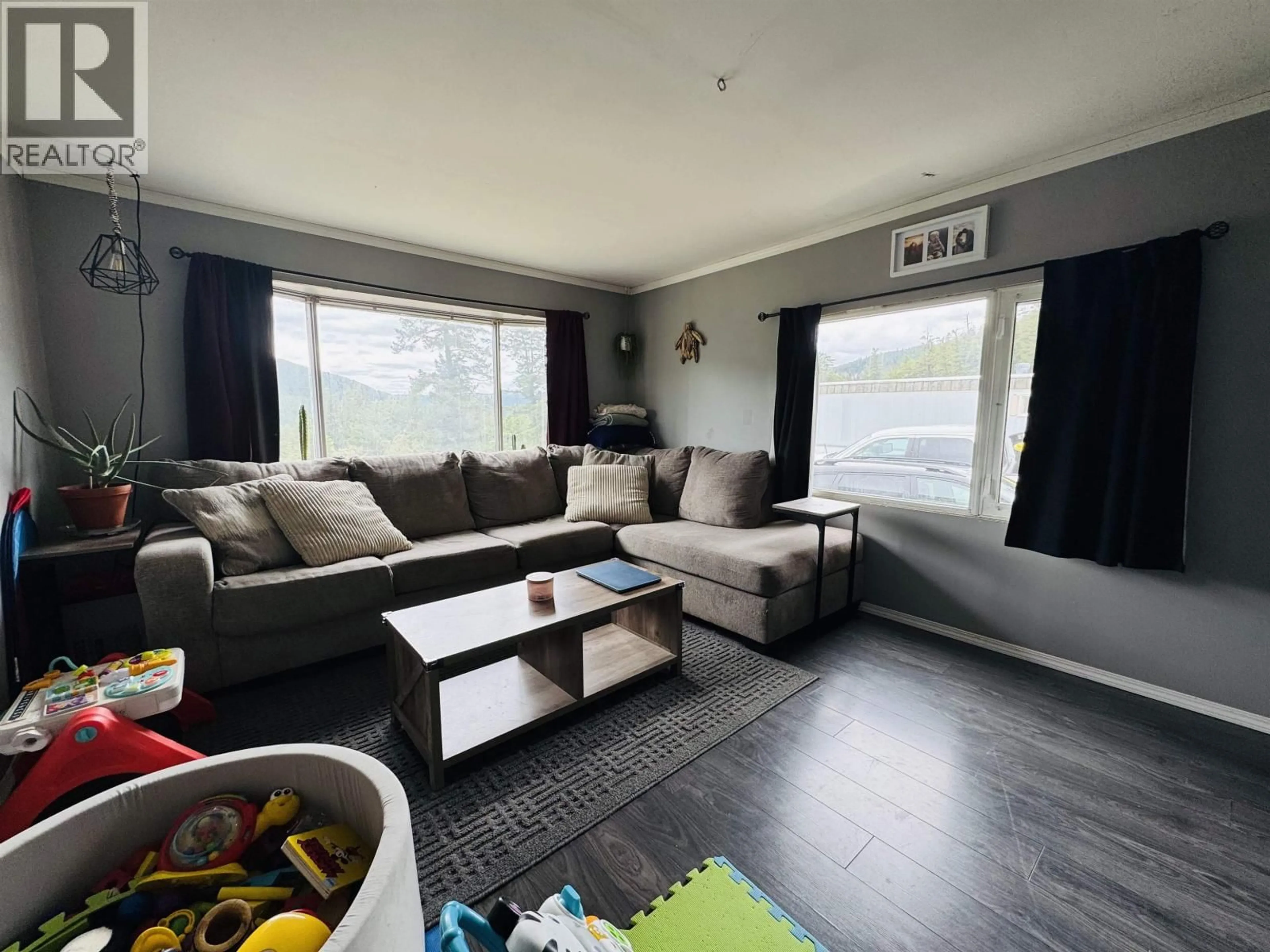 Living room with furniture, wood/laminate floor for T6 - 560 SODA CREEK ROAD, Williams Lake British Columbia V2G5E7